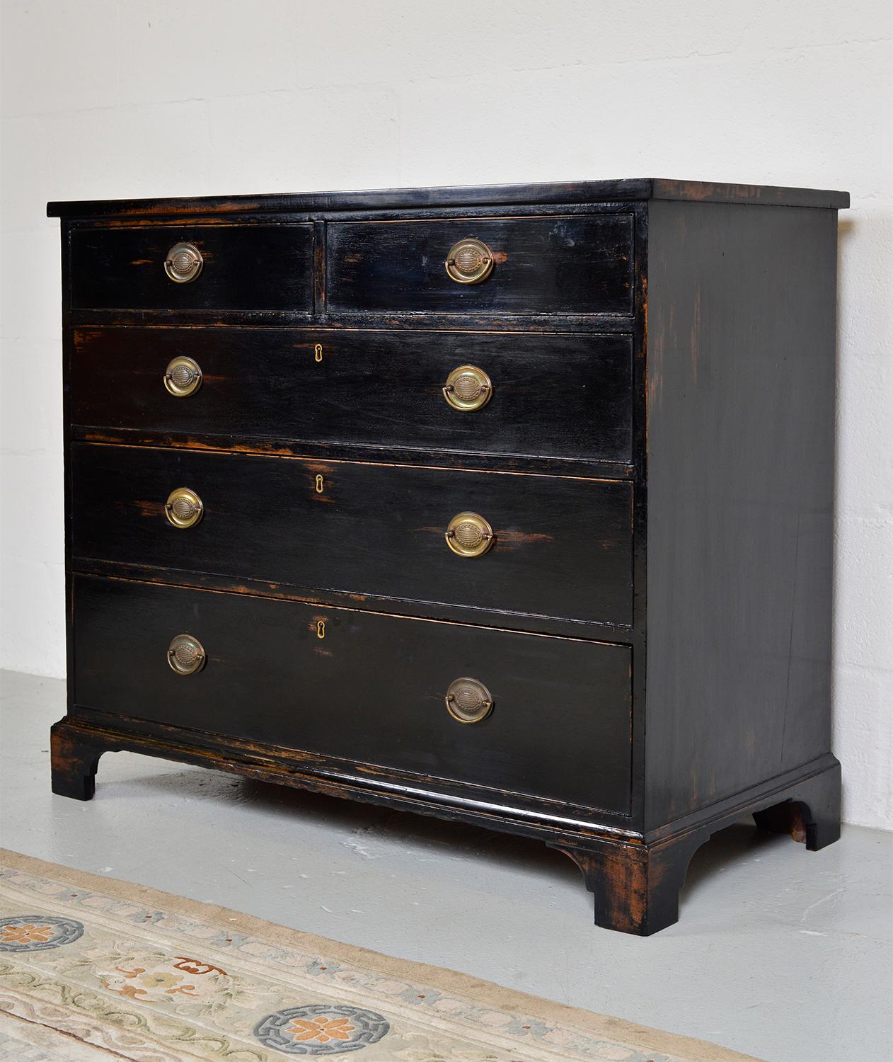 A late 19th century ebonized chest of drawers in the aesthetic taste. The chest sits on bracket feet with great proportions. The wear to the ebonized paint is fantastic and shows rich tones of the mahogany peeking through. Oak lined, dovetail