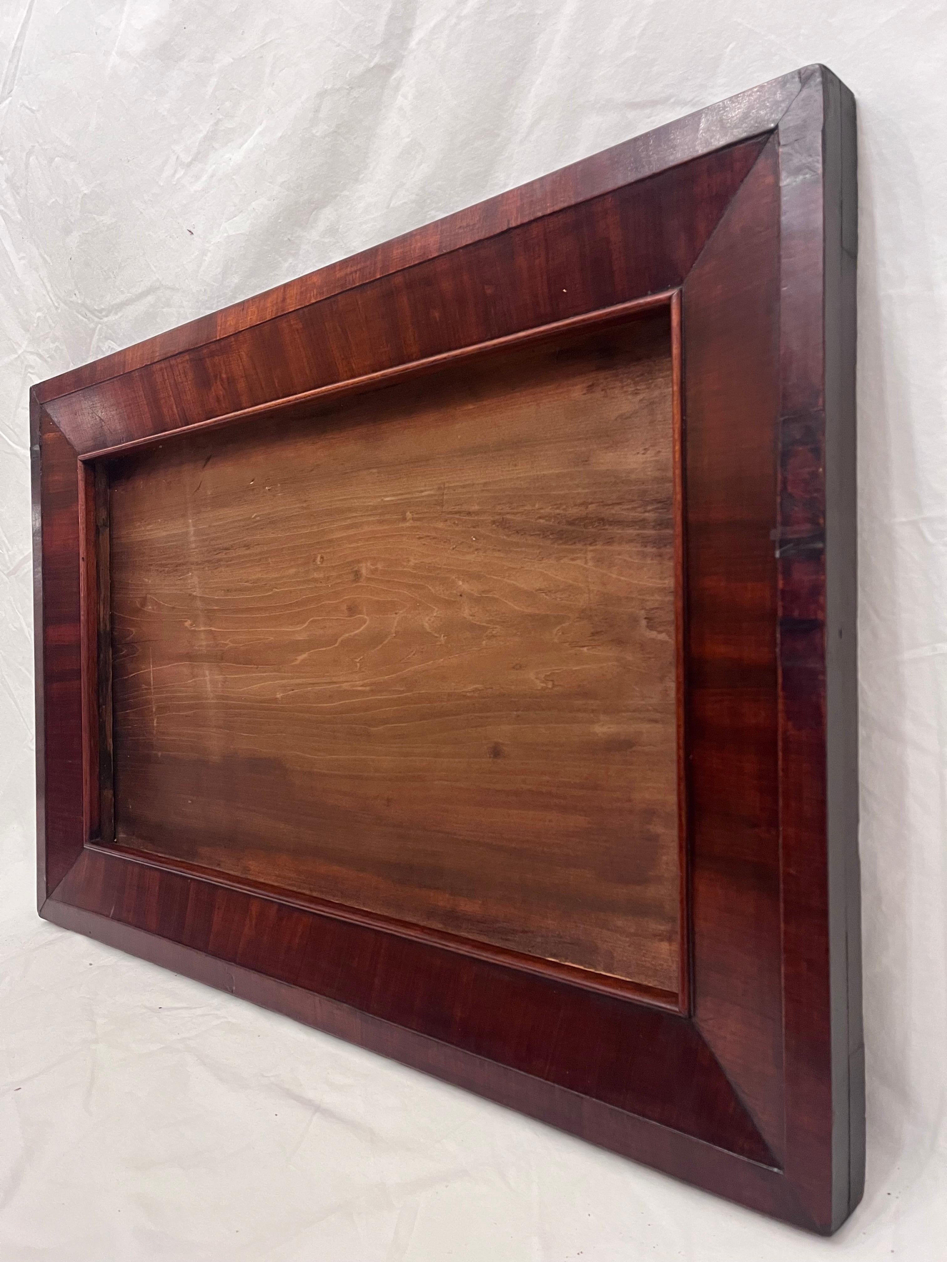 A beautiful and antique late 19th century circa 1870's American Empire style picture frame. The rabbet size (size that holds the art) is 26.25