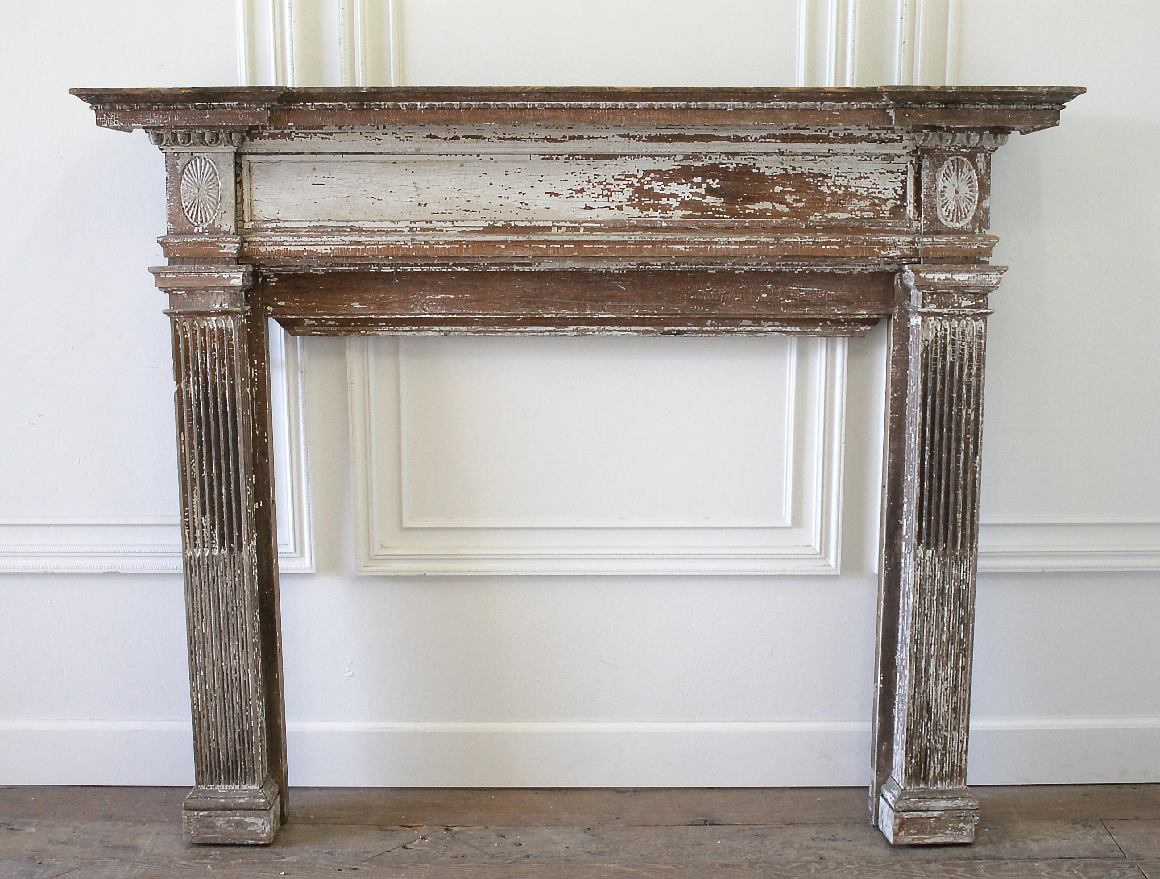 19th century antique architectural salvage mantle
Original finish, creamy white chippy paint. The mantle is made from two different types of wood, very solid, with lots of decorative details. The inside trim for the opening is missing on the sides,