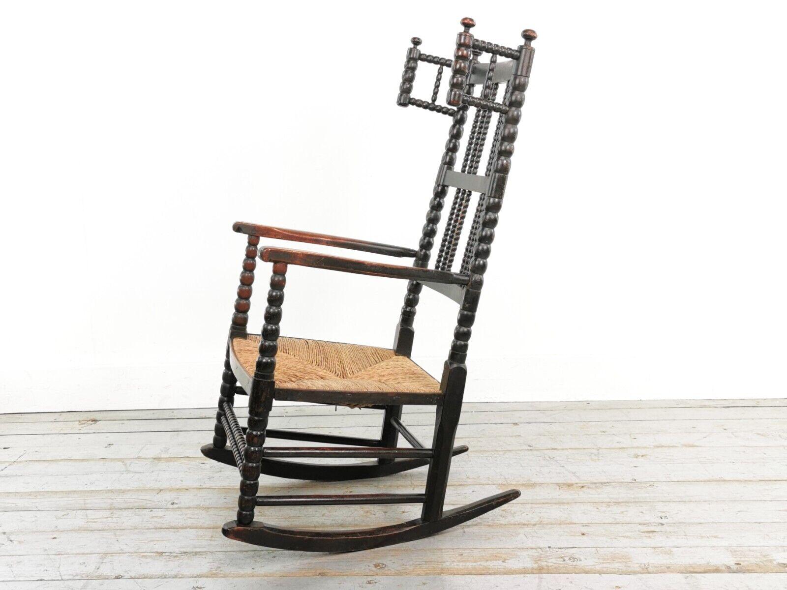 Antique Bobbin rocking chair.

A late 19th century antique arts and crafts bobbin rocking chair. A genuine country-made chair.

Ebonised wooden frame with a rush seat.

A charming chair in very good antique condition, the ebonised paint has