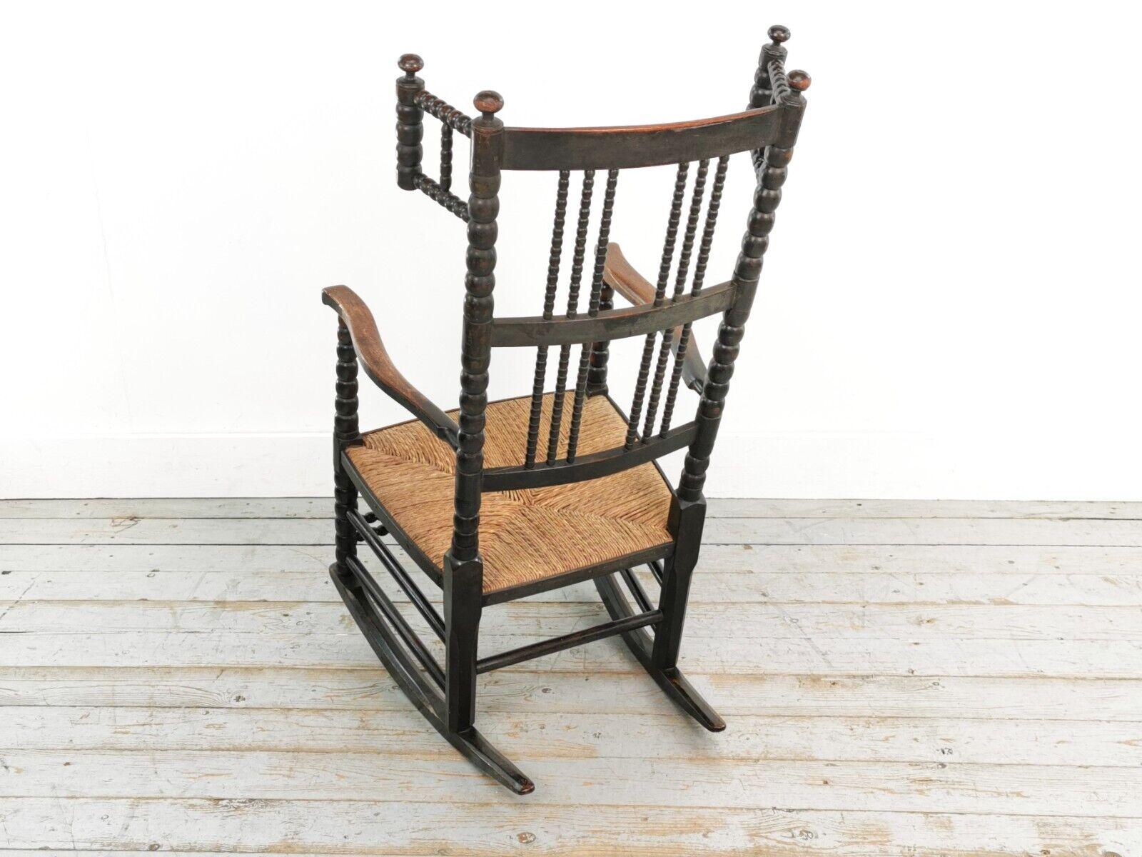British 19th Century Antique Arts and Crafts Ebonized Bobbin Rocking Chair For Sale
