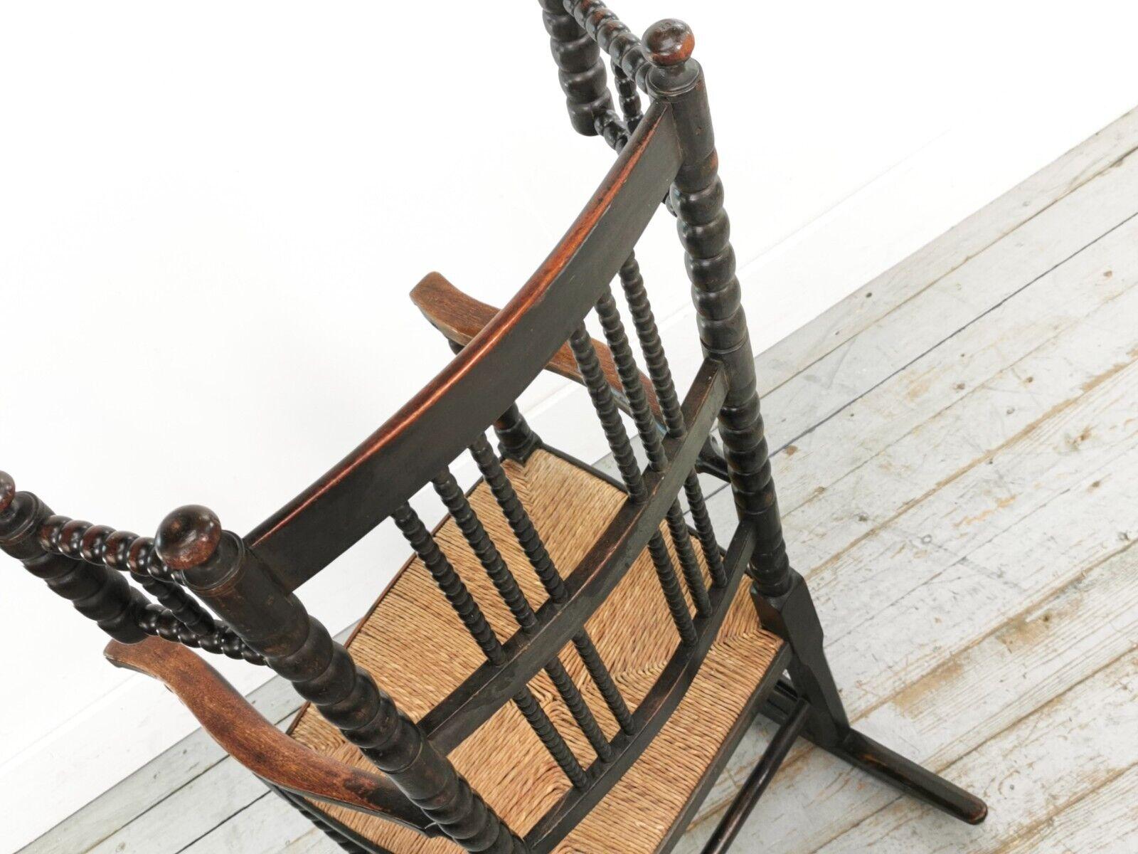 Wood 19th Century Antique Arts and Crafts Ebonized Bobbin Rocking Chair For Sale