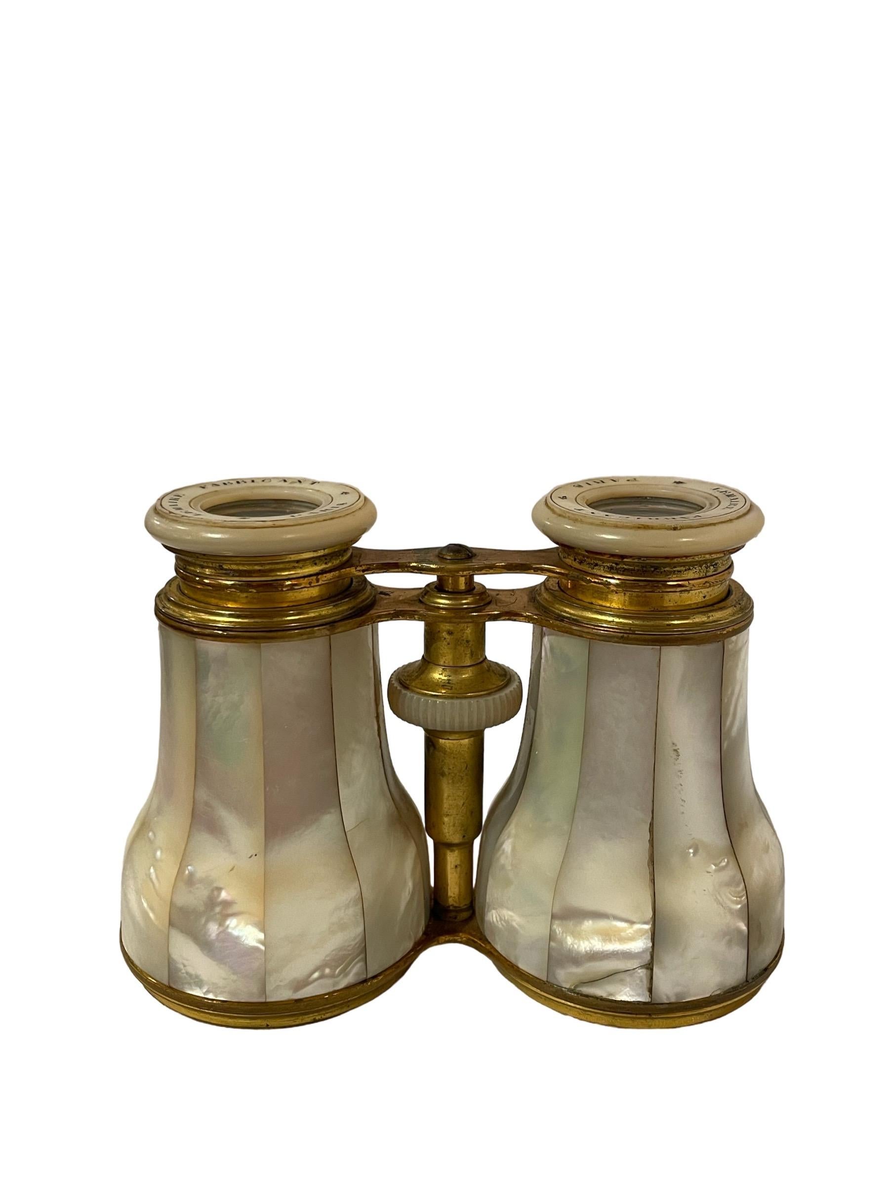 19th Century Antique Brass and Mother of Pearl Opera Glasses 

Miniature binoculars or opera glasses. Made of brass and mother of pearl panels. Made by Jacques LeMaire in Paris. 

Width: 2.5” - 1.5”
Length: 5”
Height: 3.5”