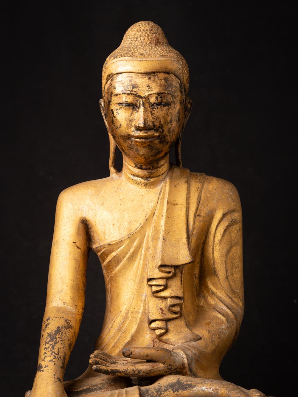 The antique bronze Burmese Mandalay Buddha is a captivating and sacred artifact originating from Burma. Crafted from bronze and gilded with 24-karat gold, this Buddha statue stands at 54 cm in height and measures 39 cm in width and 25.5 cm in depth.