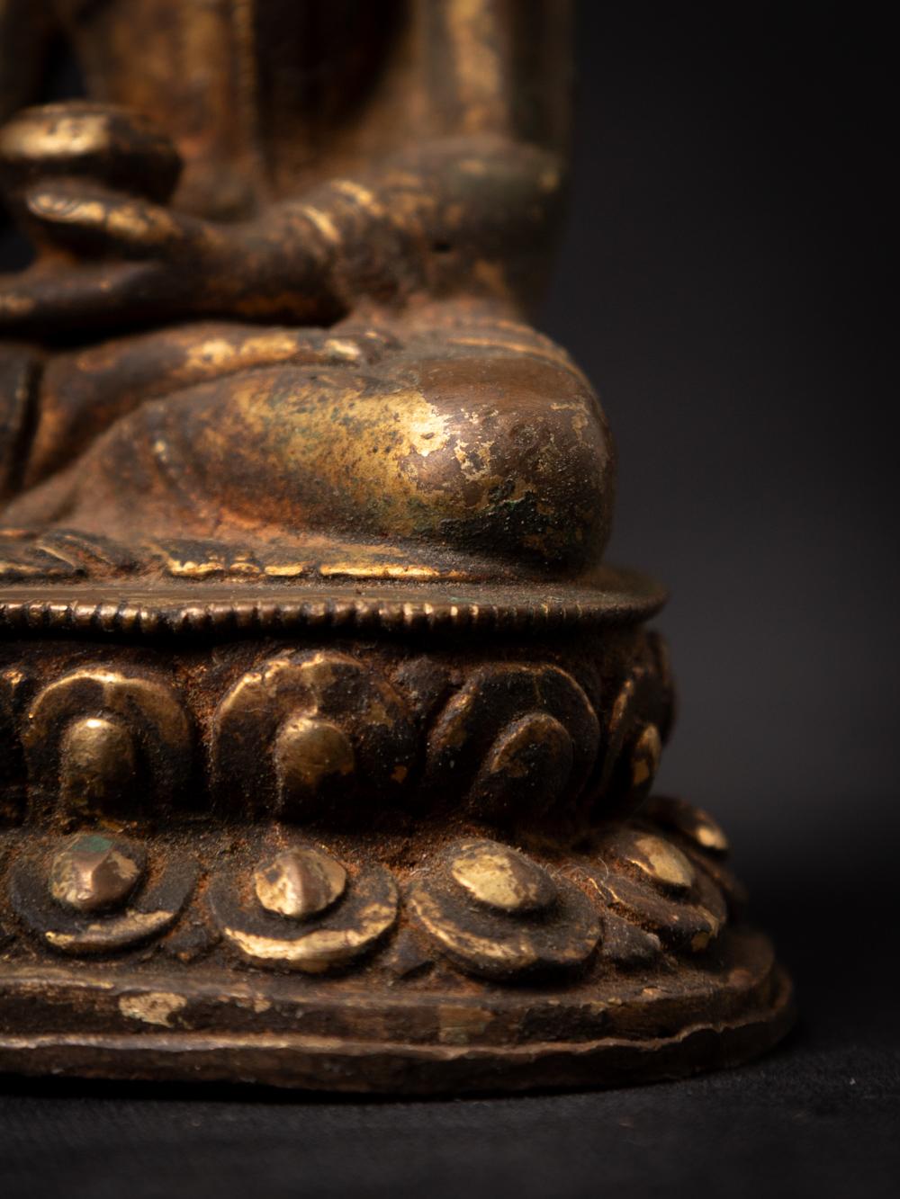 19th century antique bronze Nepali Buddha statue in Bhumisparsha Mudra For Sale 9