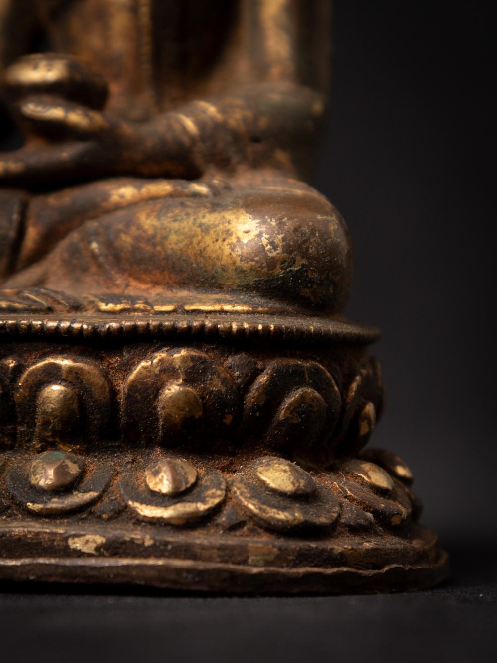 19th century antique bronze Nepali Buddha statue in Bhumisparsha Mudra For Sale 11