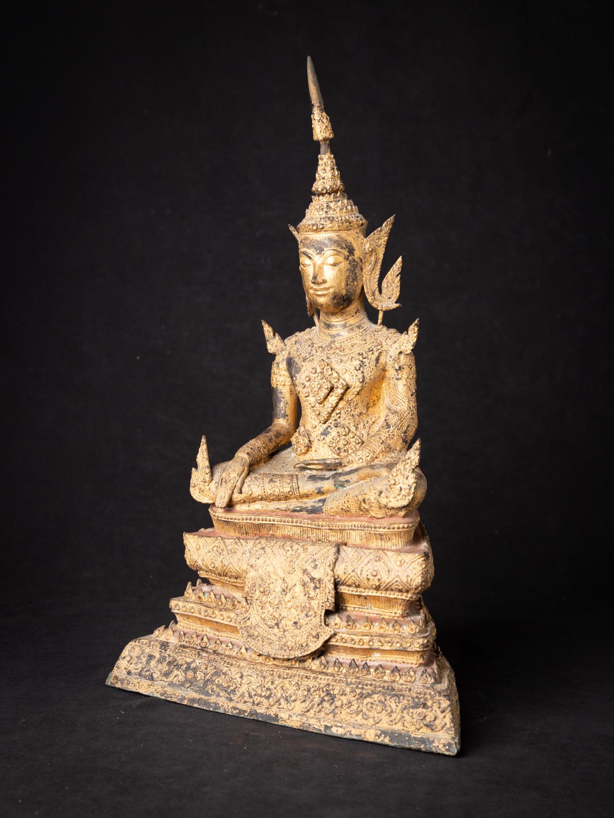 This antique bronze Thai Rattanakosin Buddha is a magnificent representation of Buddhist art and spirituality. Crafted from bronze, it stands at an impressive height of 42.3 cm with dimensions of 26 cm in width and 16 cm in depth. The statue is