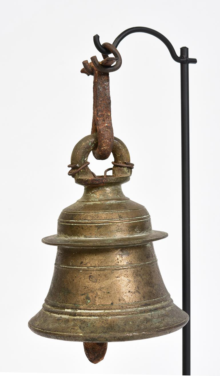 Burmese bronze bell with clapper inside with stand.

Age: Burma, 19th century
Size: height 15.2 cm / width 8.8 cm
Size including stand: height 31.5 cm
Condition: Nice condition overall (some expected degradation due to its age).

100%