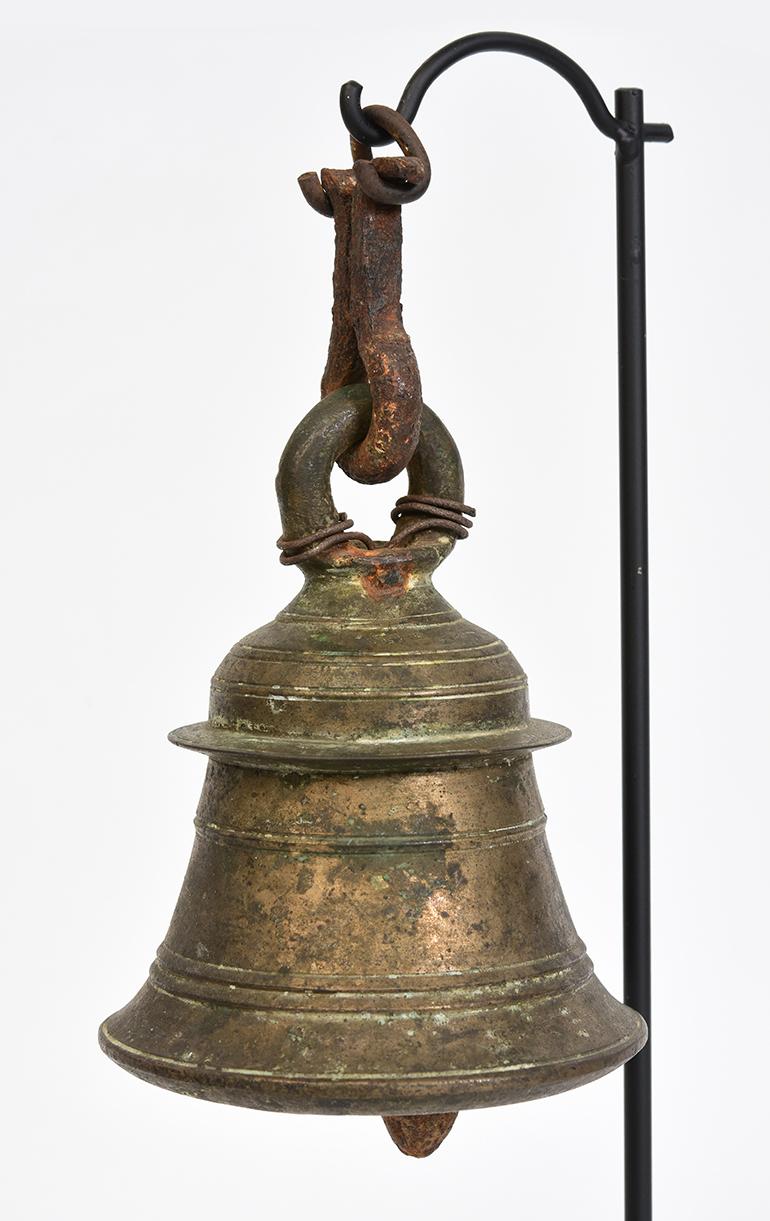 Burmese bronze bell with clapper inside with stand.

Age: Burma, 19th century
Size: Height 15.2 C.M. / Width 8.8 C.M.
Size including stand: Height 32 C.M.
Condition: Nice condition overall (some expected degradation due to its age).

100%