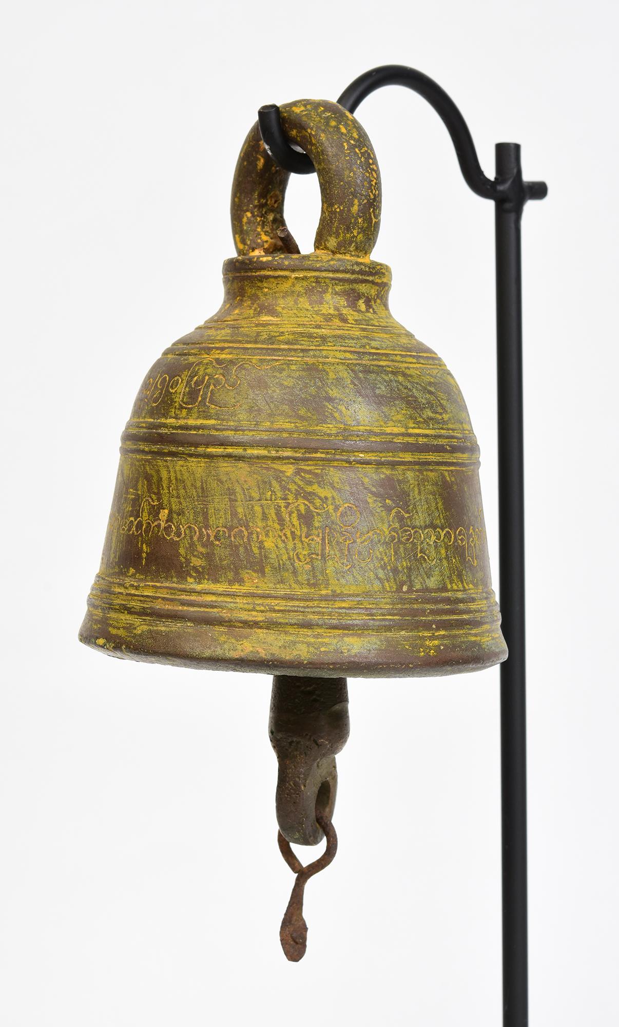 Antique Burmese bronze bell with clapper inside with stand.

Age: Burma, 19th Century
Size of bell only: Height 12.5 C.M. / Width 9.4 C.M.
Height including stand: 34.5 C.M.
Condition: Nice condition overall (some expected degradation due to its