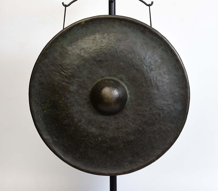 Burmese bronze gong, a kind of Burmese musical instrument which produces a loud and sonorous sound. Gong stick is included.

Age: Burma, 19th century
Size: Diameter 53.5 C.M. / Thickness 9 C.M.
Size including stand: Height 82.5 C.M.
Condition: