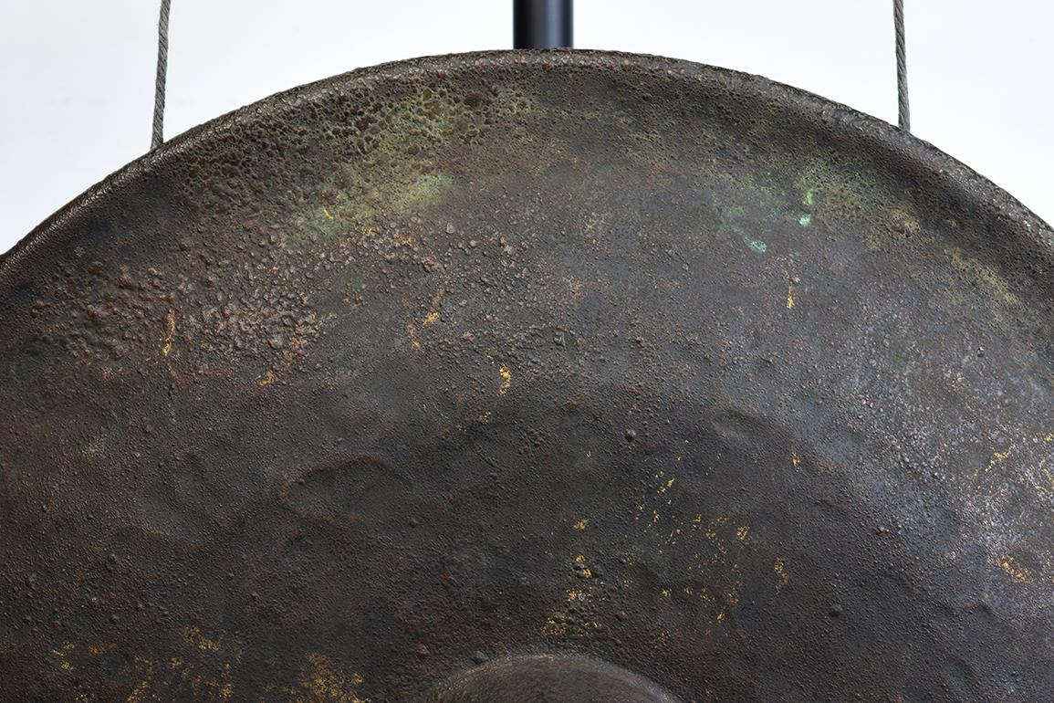 Burmese bronze gong, a kind of Burmese musical instrument which produces a loud and sonorous sound. Gong stick is included.

Age: Burma, 19th century
Size: Diameter 56 C.M. / Thickness 10 C.M.
Size including stand: Height 82.4 C.M.
Condition: