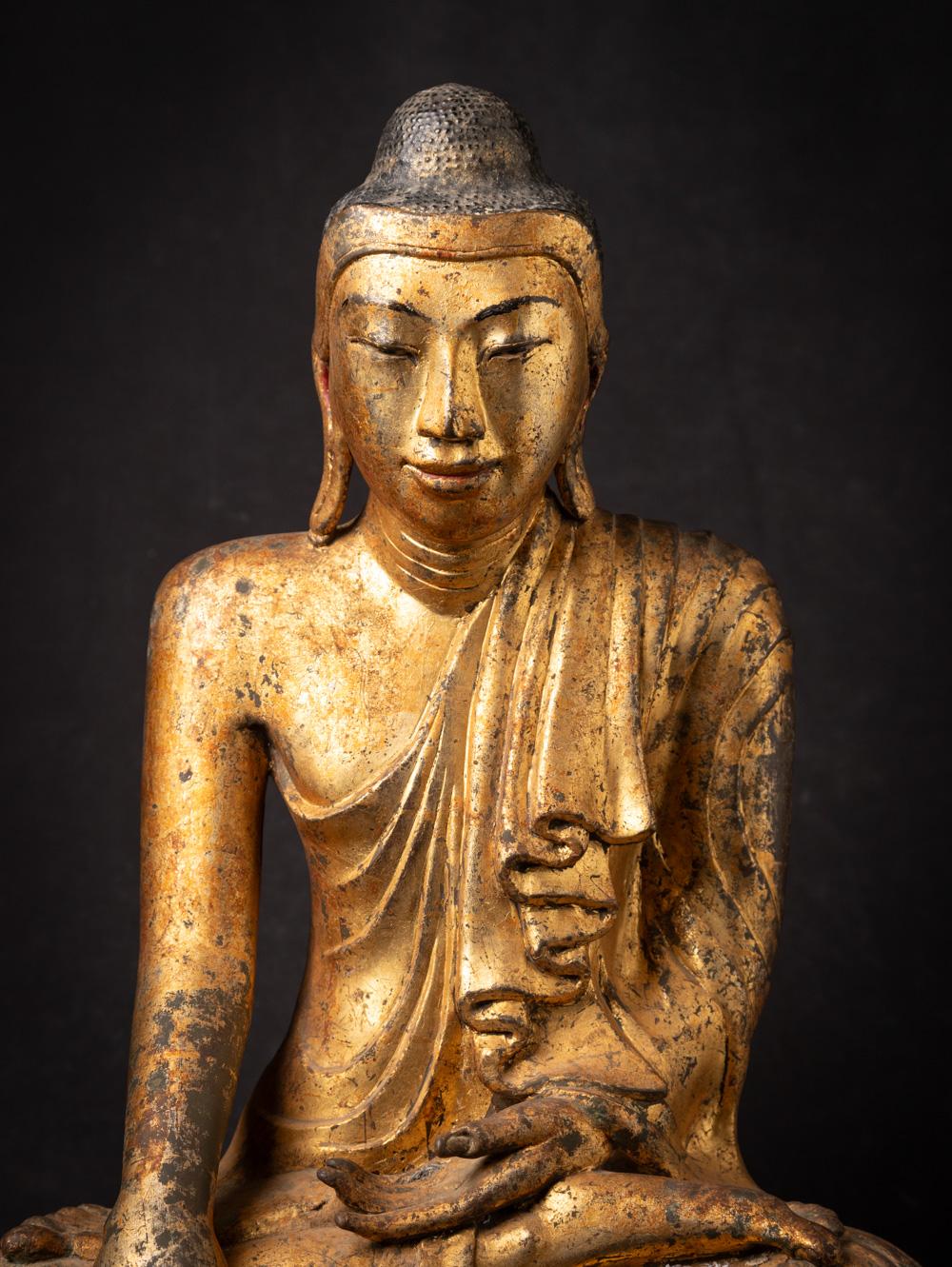 This 19th century Antique Burmese bronze Mandalay Buddha is a truly unique and special collectible piece. Standing at 57,5 cm high, 46,5 cm wide, and 27,5 cm deep, it is made of bronze and it has been gilded with 24 krt gold leaf, adding to its