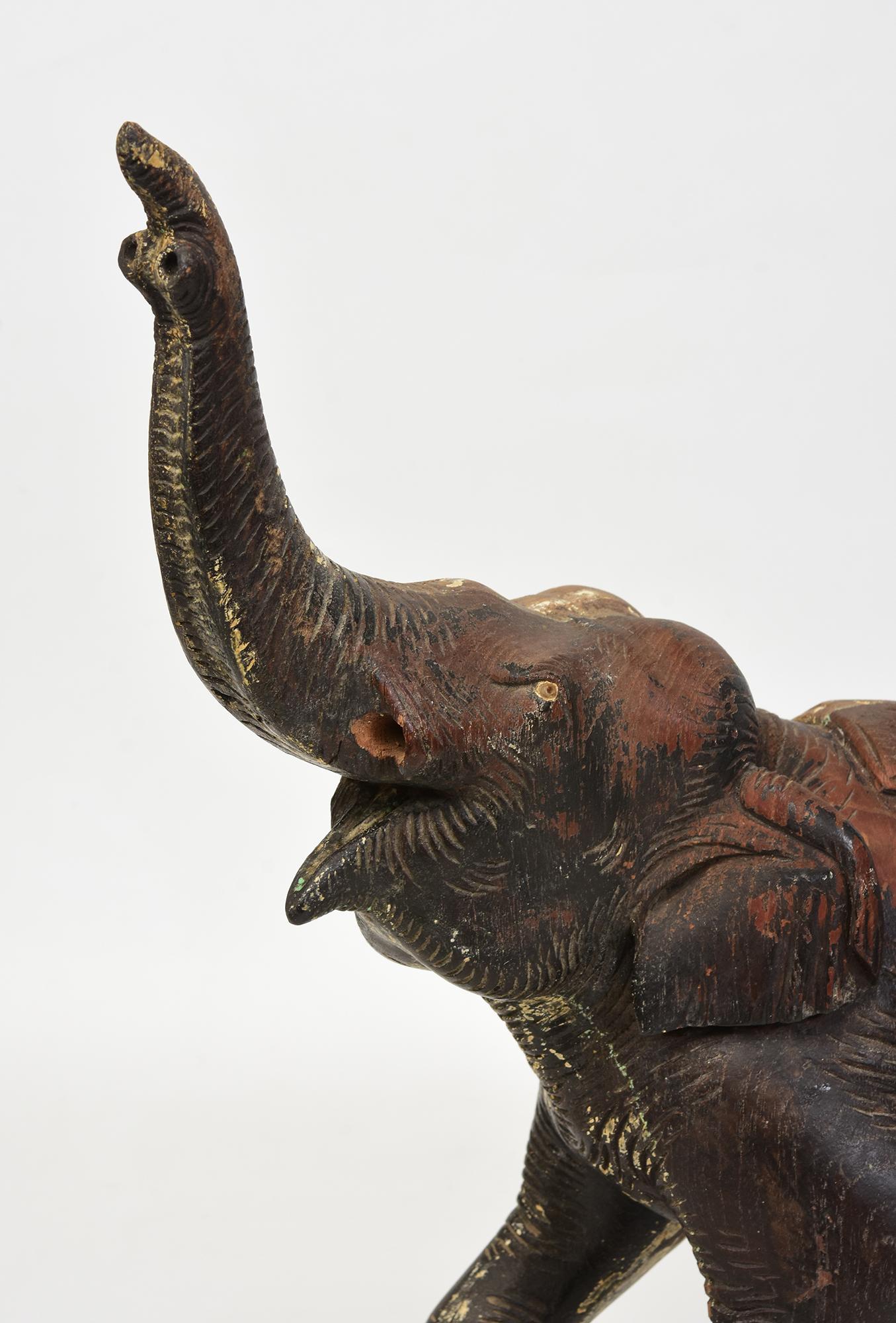 Antique Burmese wooden elephant.

Age: Burma, 19th Century
Size: Height 40.3 C.M. / Width 14.5 C.M. / Length 36.5 C.M.
Condition: Nice condition overall (some expected degradation due to its age).

100% Satisfaction and authenticity guaranteed with