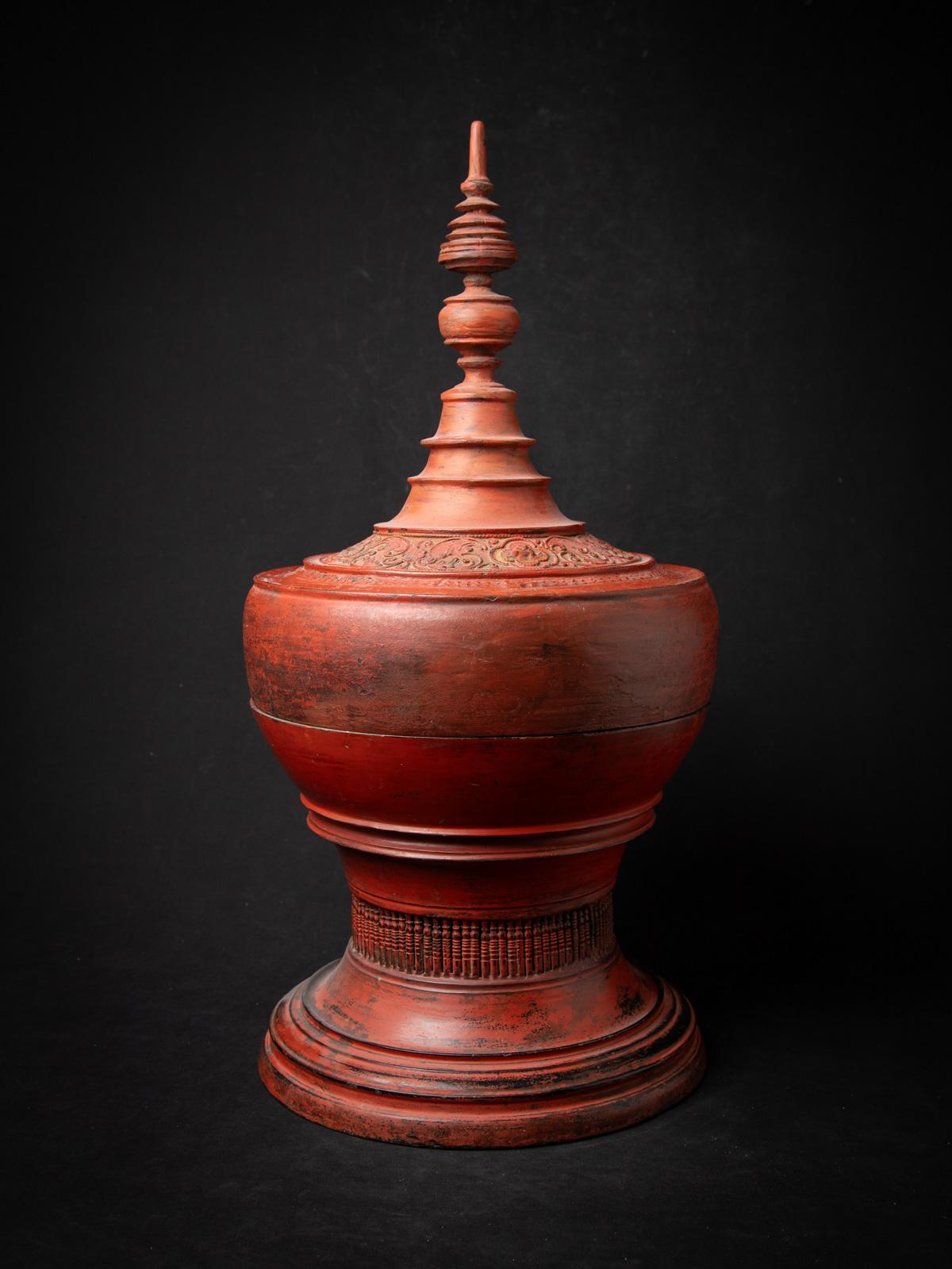 This antique Burmese wooden offering vessel, originating from Burma (modern-day Myanmar) and crafted in the distinguished Shan (Tai Yai) style, is a striking example of traditional craftsmanship and religious significance. Made entirely from wood,