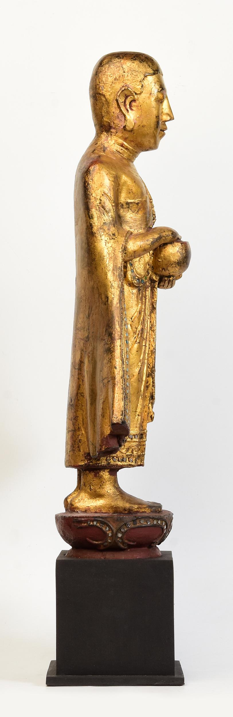 19th Century, Antique Burmese Wooden Standing Disciple / Monk Holding Bowl For Sale 7