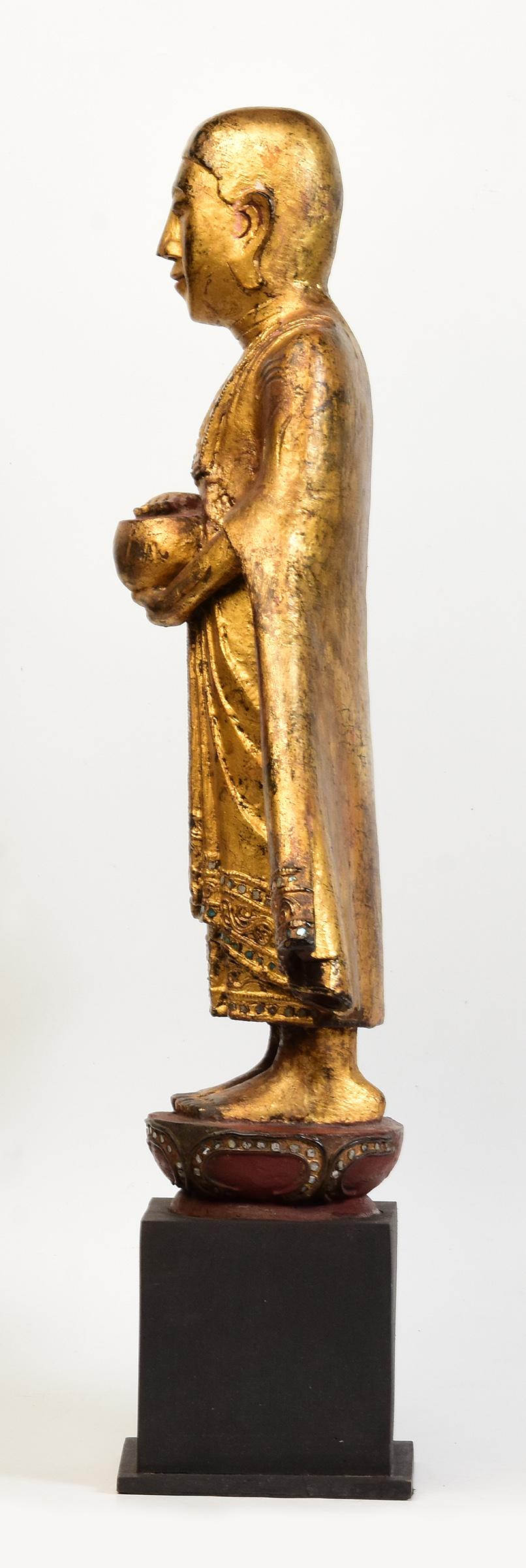 19th Century, Antique Burmese Wooden Standing Disciple / Monk Holding Bowl For Sale 4