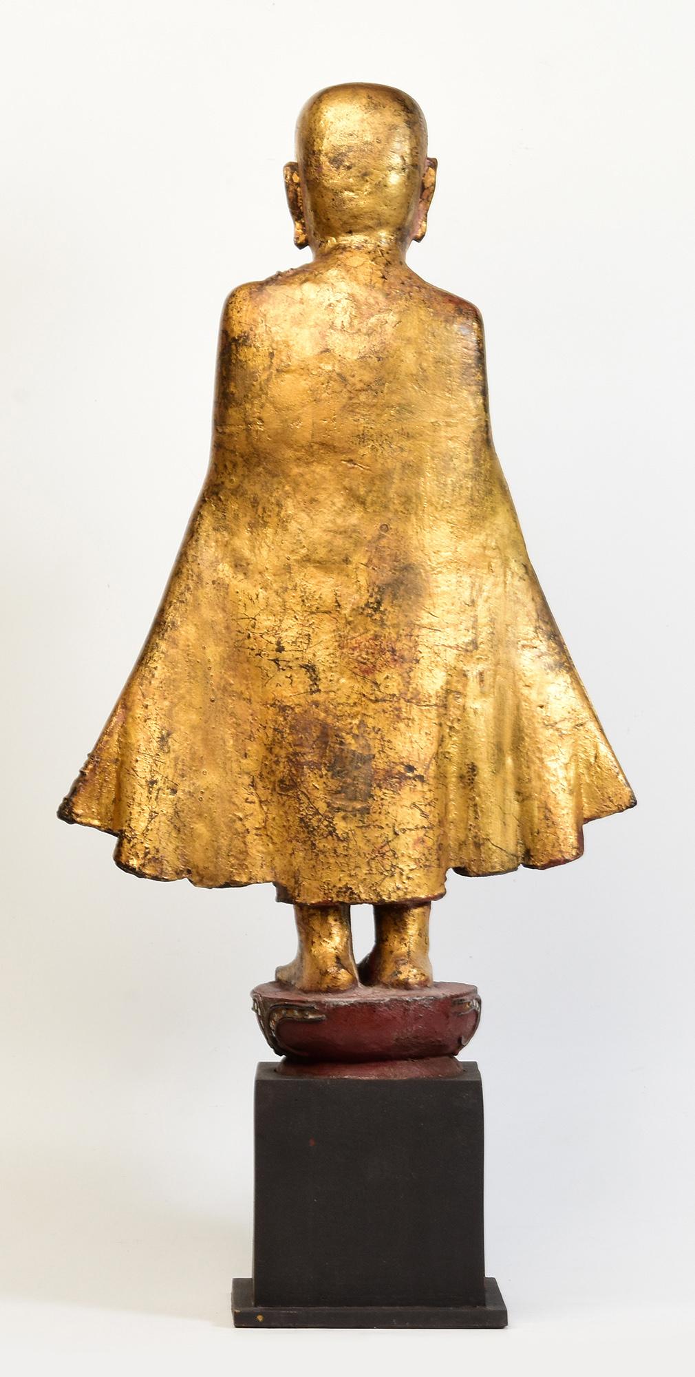 19th Century, Antique Burmese Wooden Standing Disciple / Monk Holding Bowl For Sale 5
