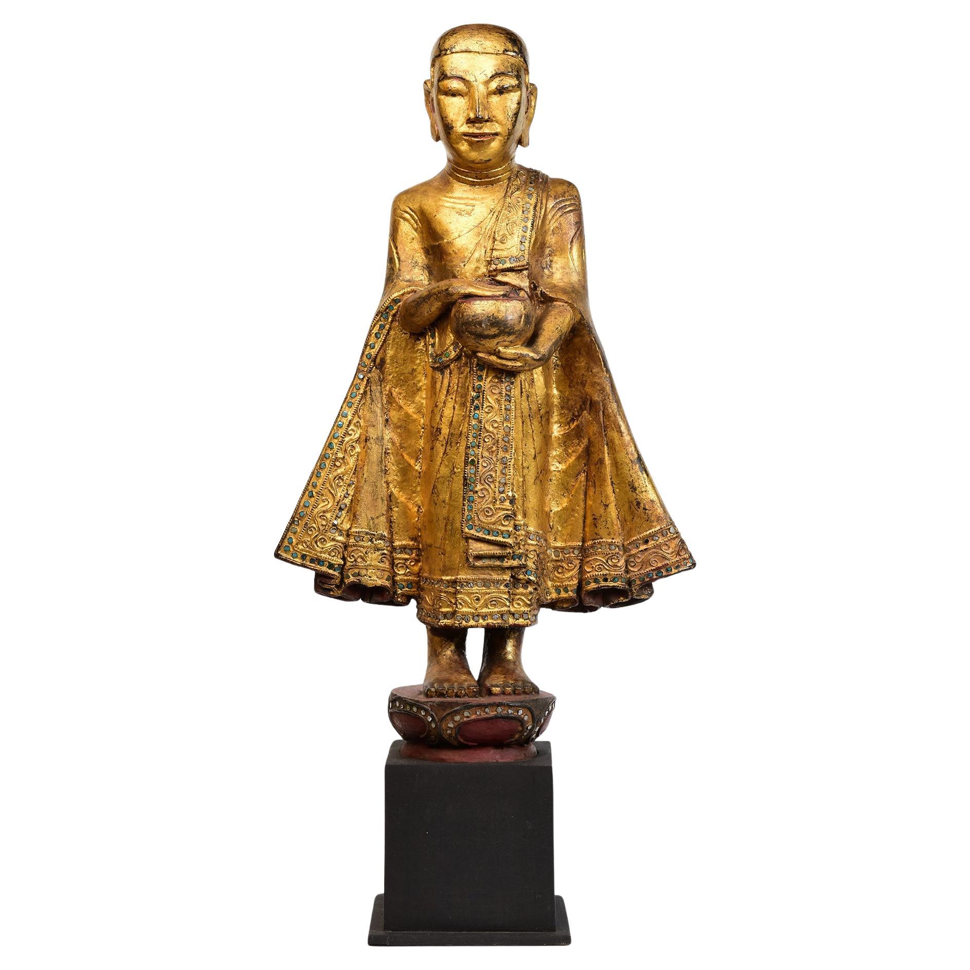 19th Century, Antique Burmese Wooden Standing Disciple / Monk Holding Bowl For Sale