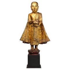 19th Century, Antique Burmese Wooden Standing Disciple / Monk Holding Bowl