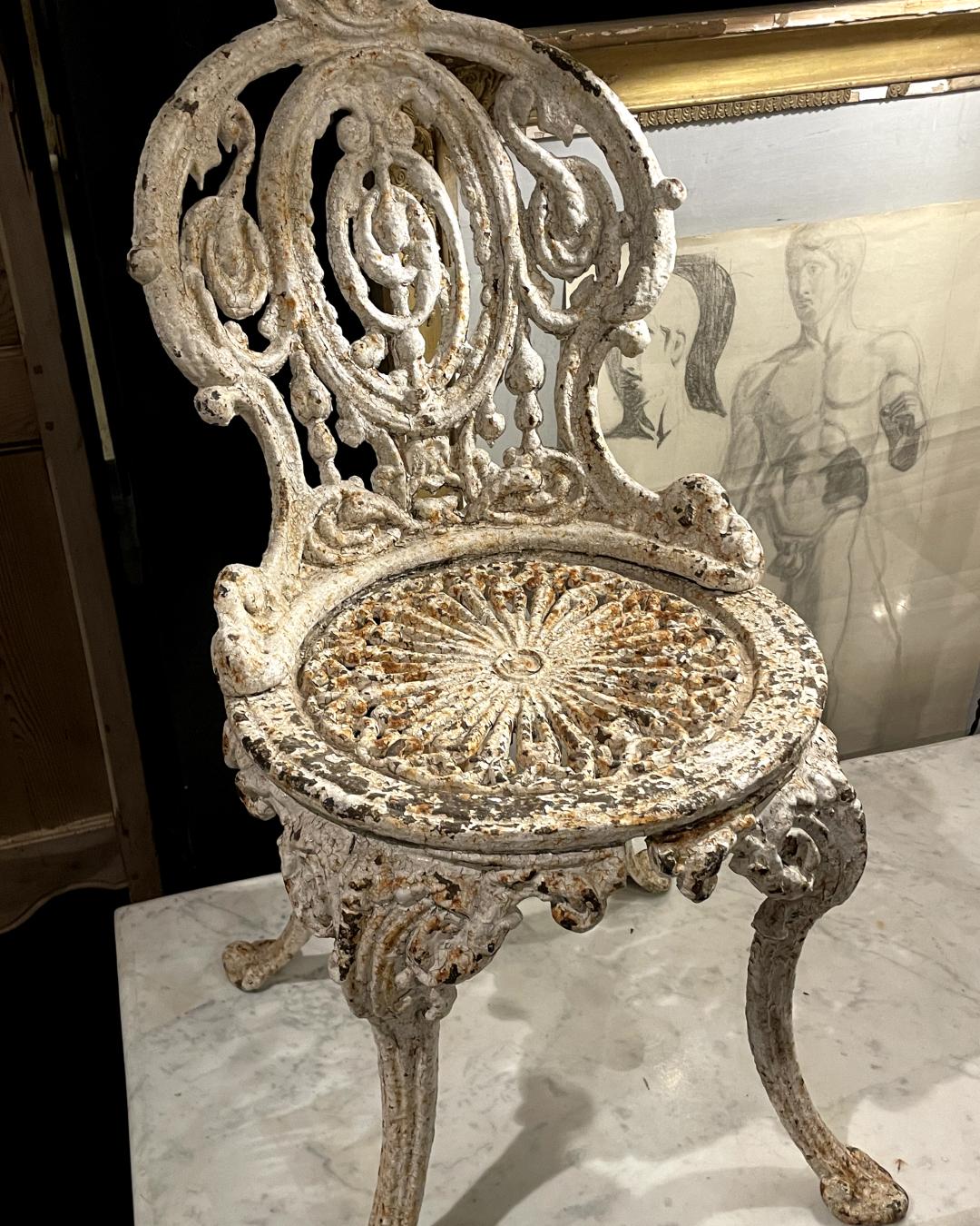 Introduce a touch of timeless elegance to your outdoor space with our Antique Cast Iron Garden Chairs. Originating from France in the late 19th century, this enchanting pair showcases exquisite craftsmanship and enduring charm. Crafted from cast