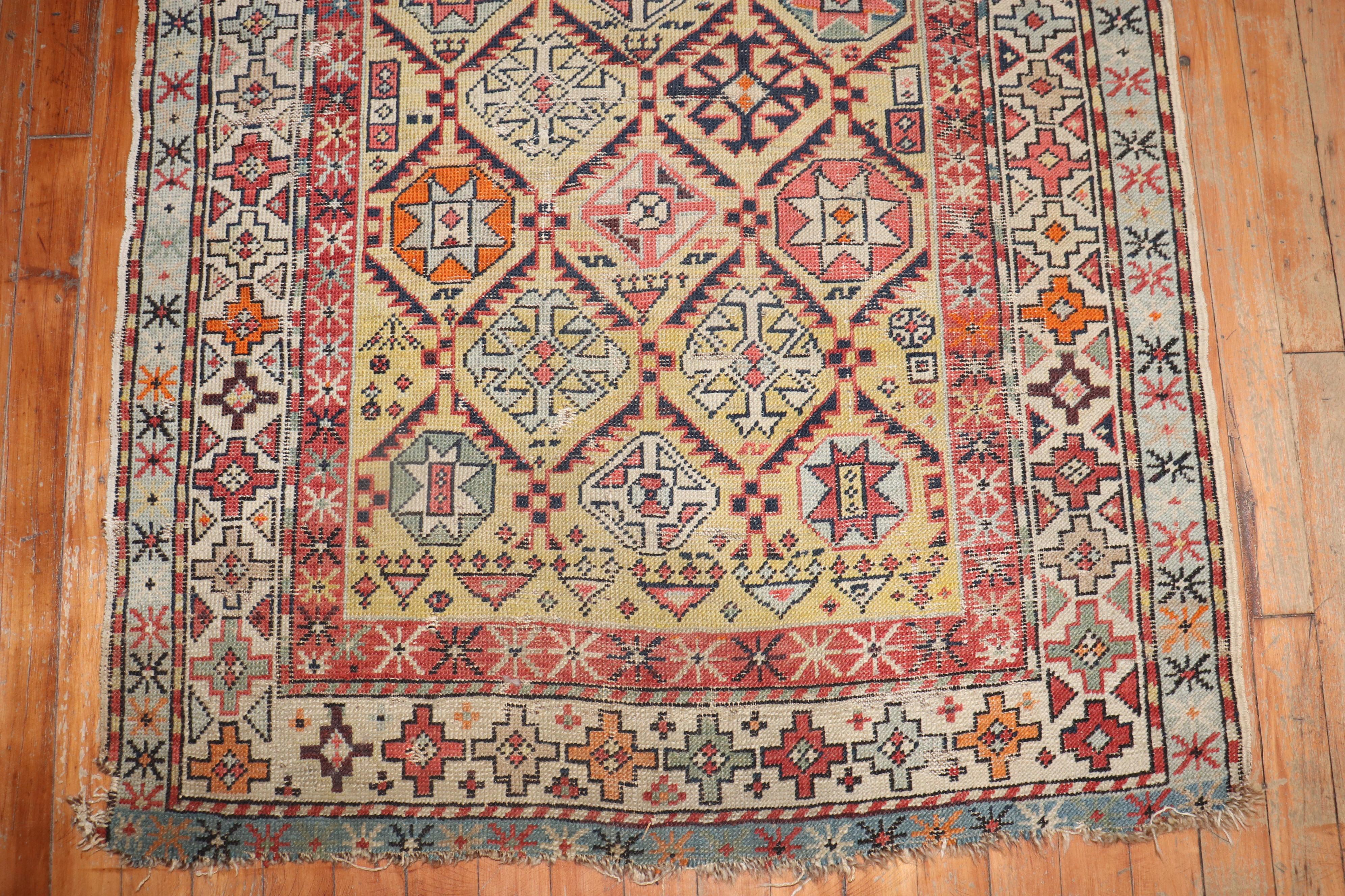 Rustic Zabihi Collection 19th Century Antique Caucasian Rug For Sale
