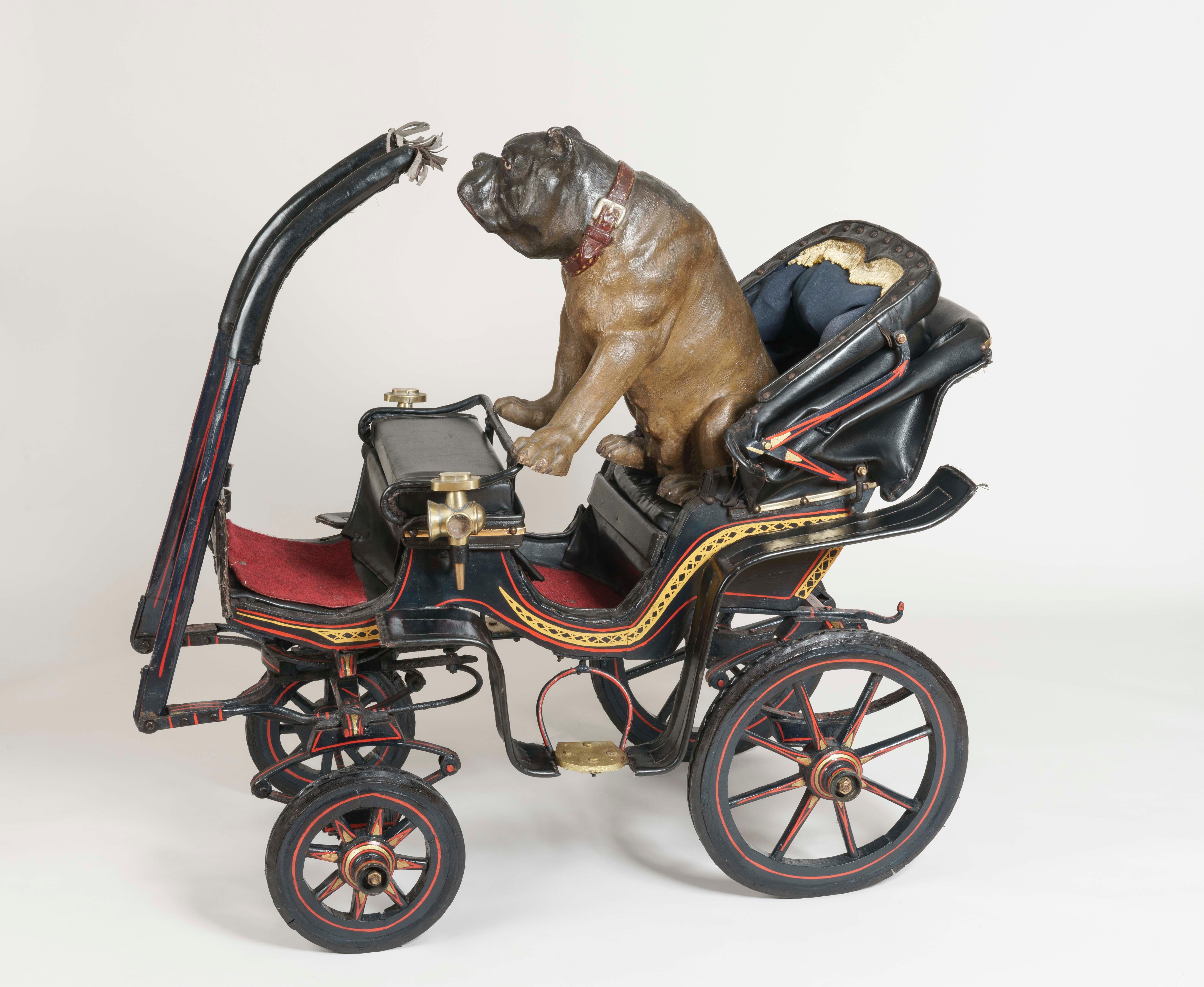 A Children’s Painted Calèche

Modelled on a full-sized barouche, this fully functional children’s carriage was either goat- or dog-drawn. The frame replicated in great detail, having hand-painted coachwork, brass carriage lamps, a studded leather