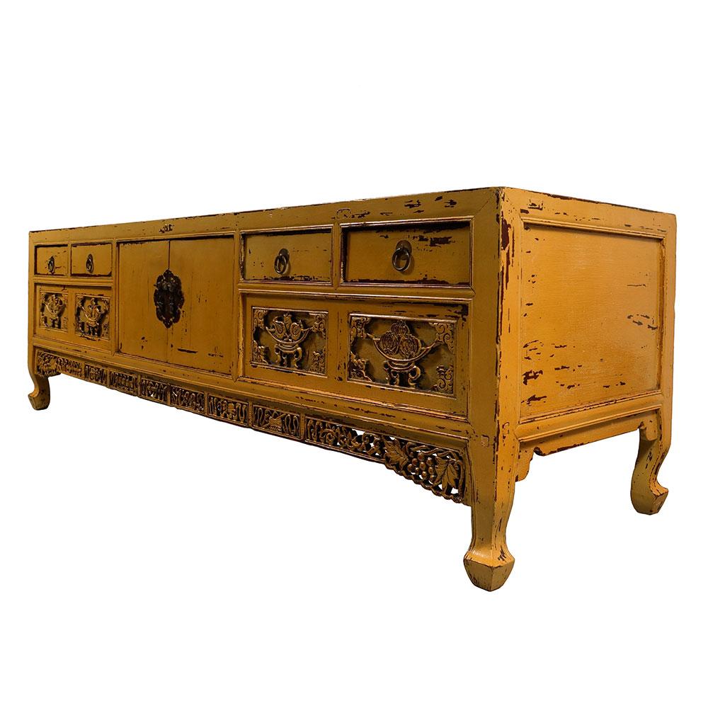 This is a traditional style of yellow lacquered antique Chinese bed foot chest. Normally it was set on the bed and used to store clothes and jewelry. It has a lot of Chinese traditional carving works on the front. This chest made from solid Elm wood