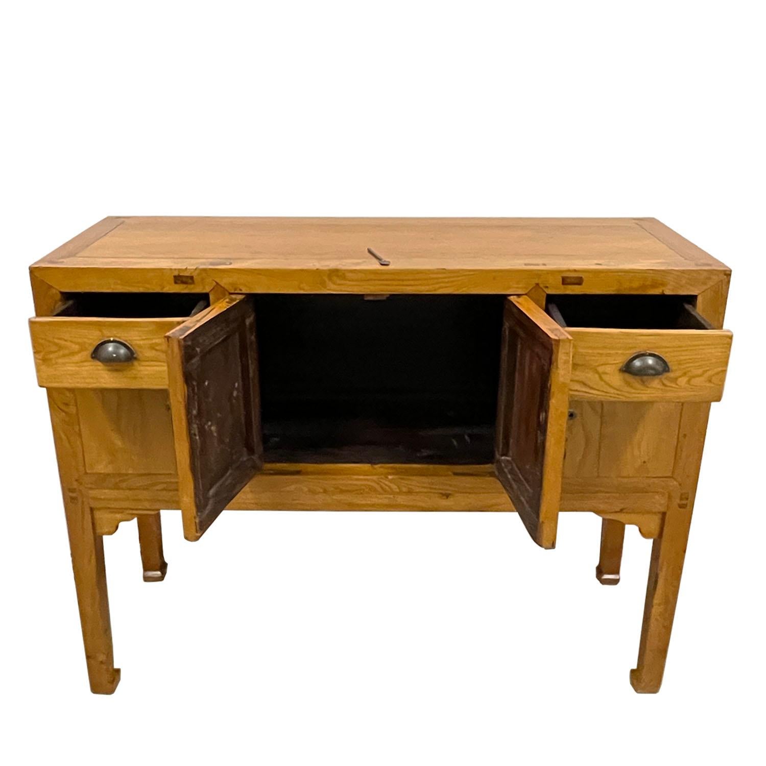 This Antique Chinese Entry Console/Side Table has about 150 years history with natural finish. It is made from solid elm wood with beautiful antique hardware on the front. It featured 2 Drawers and 2 removable open doors on the front. Heavy and