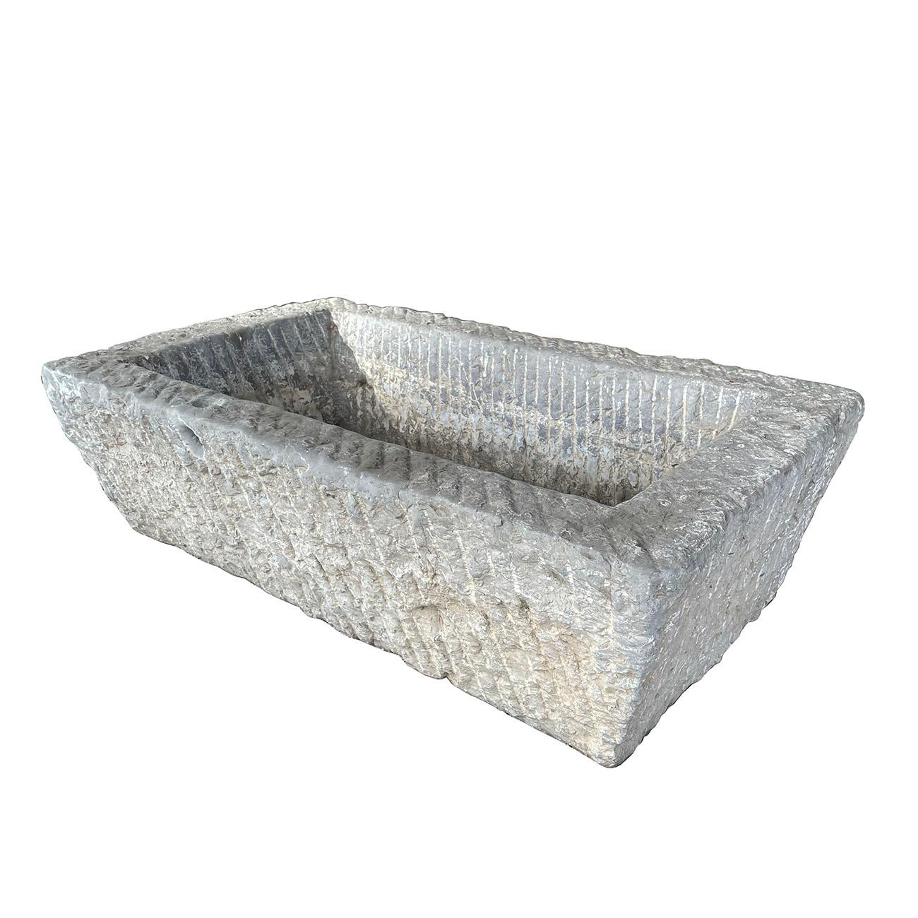 This stone trough is retrieved from the village in northern China. It is hand carved out one piece of stone and hand chiseled by the local stone master. It's originally for feeding household animals, etc. Now It can be an unique garden elements,