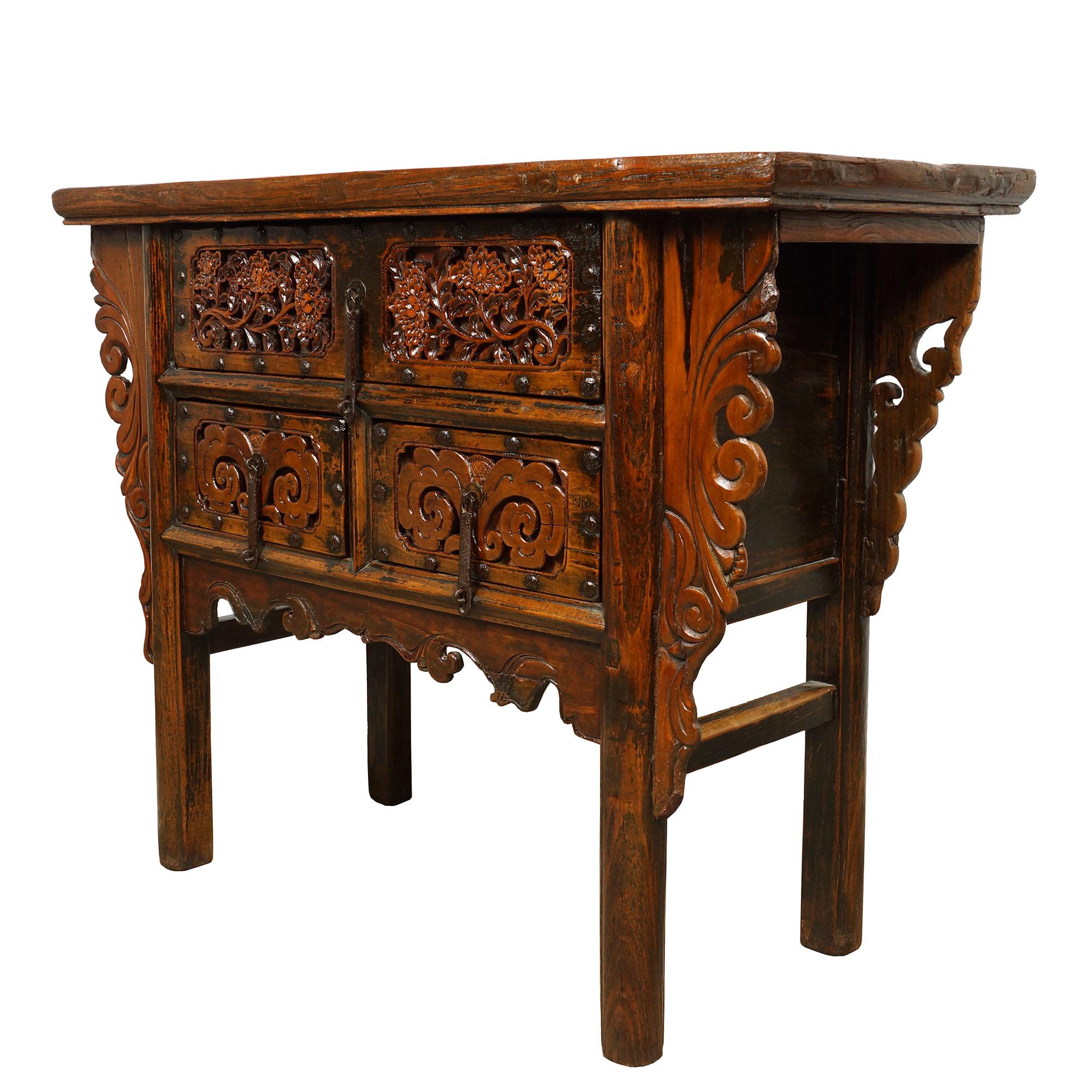 This beautiful antique carved Shan Xi console table has beautiful traditional detailed massive deep/raised carving works on the front drawer panels and legs. This console table features 1 large drawer on the top and 2 smaller drawers underneath. All