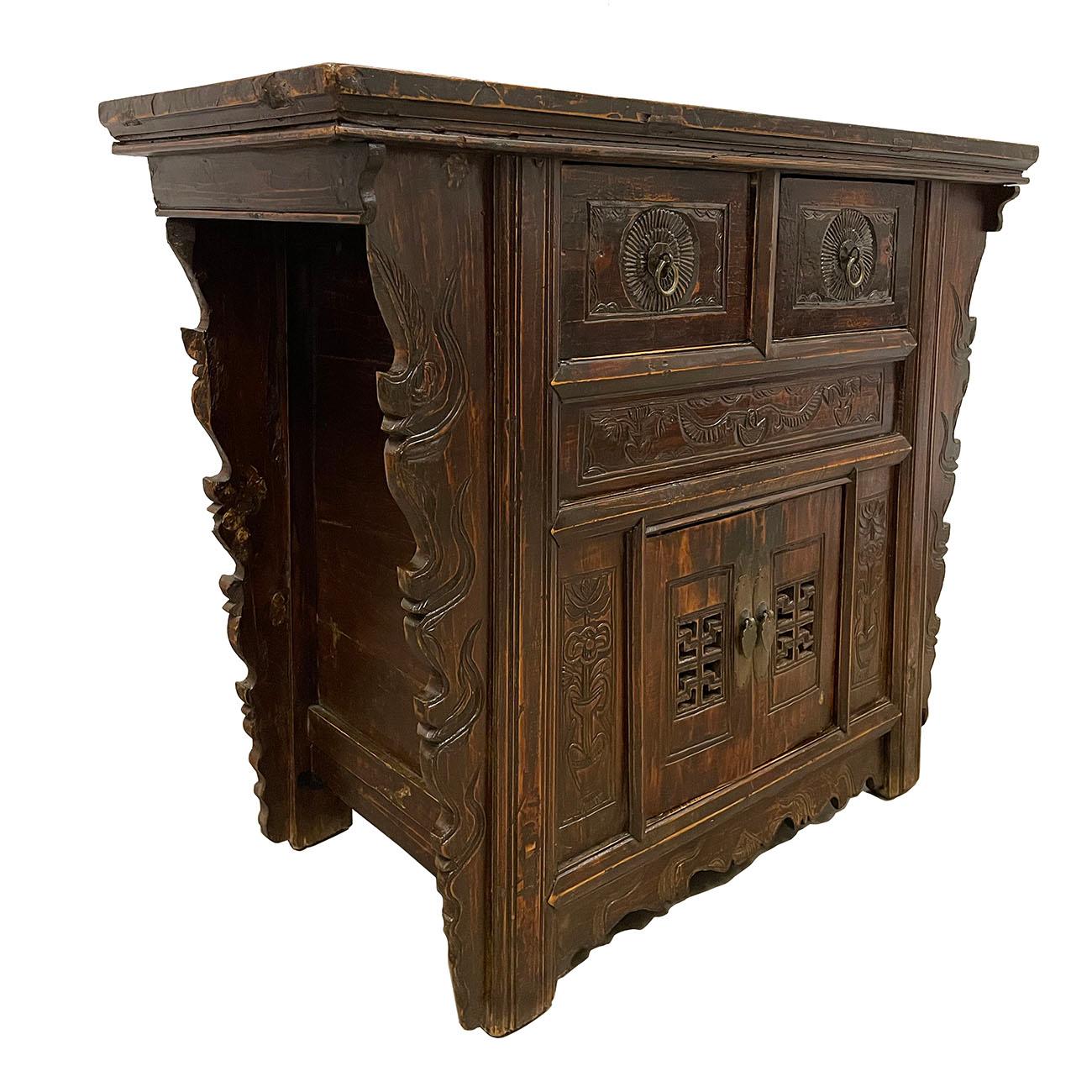 This beautiful antique Chinese coffer table has beautiful traditional Qing style carving works on the front with antique hardware. It features two drawers and one double open doors compartment on the front. Both sides and back are finished. This