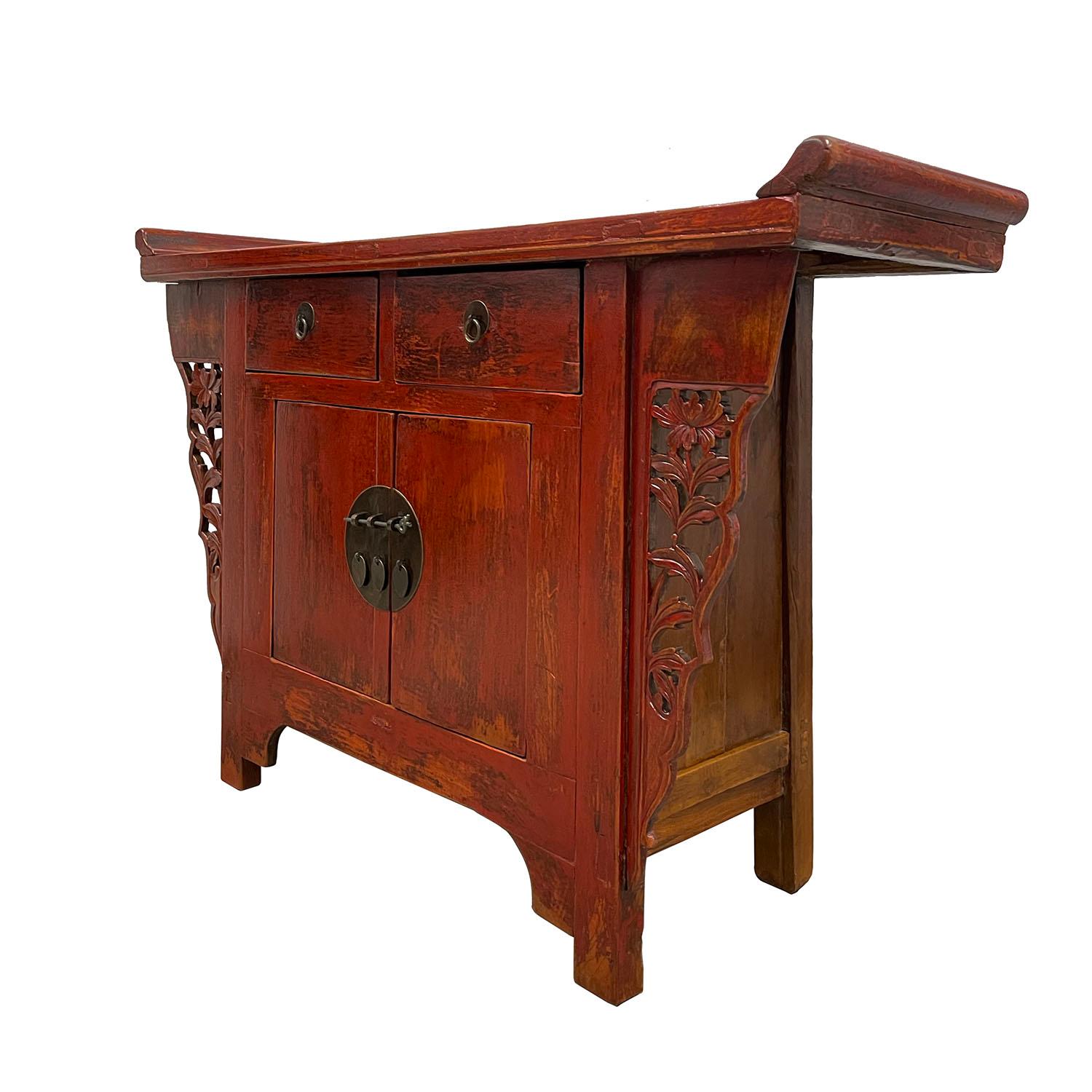 This beautiful antique console table, sideboard has beautiful traditional Ming style simple plain design on the front with red lacquer finish. There are some hand carving works of floral design on the sides. This table features two drawers and one