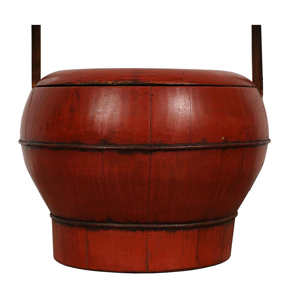 Antique wooden wedding water bucket from Zhejiang, China. It has over 120 years history and still maintained very good condition. It is made by wood panels that are lined contiguously and secured by metal loops and finished by red lacquer. Full of