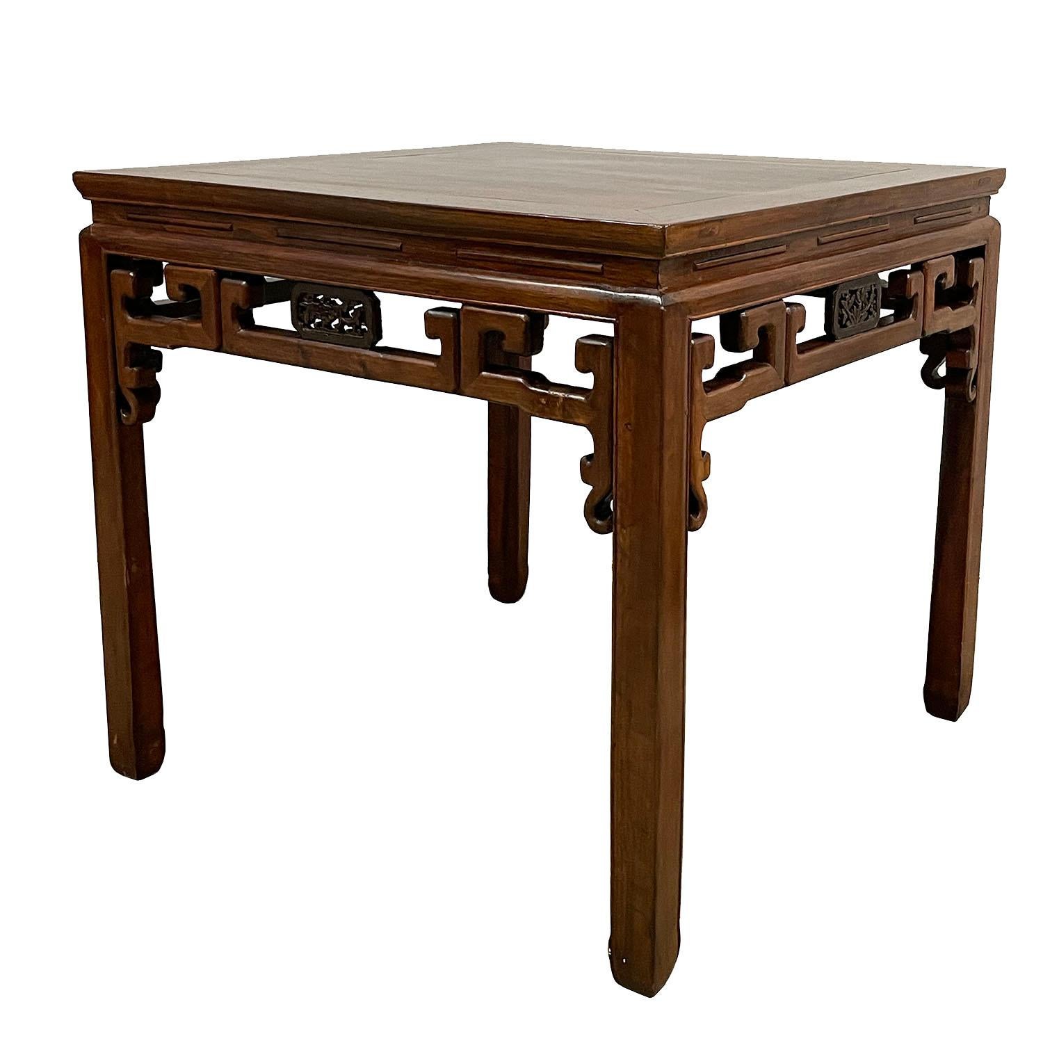 This gorgeous Chinese antique square dining table (called “Ba Xian” in Chinese, meaning eight immortals) is made from solid beech wood. Made during the 1850s, this piece features traditional carving designs inspired by the Qing dynasty on all four