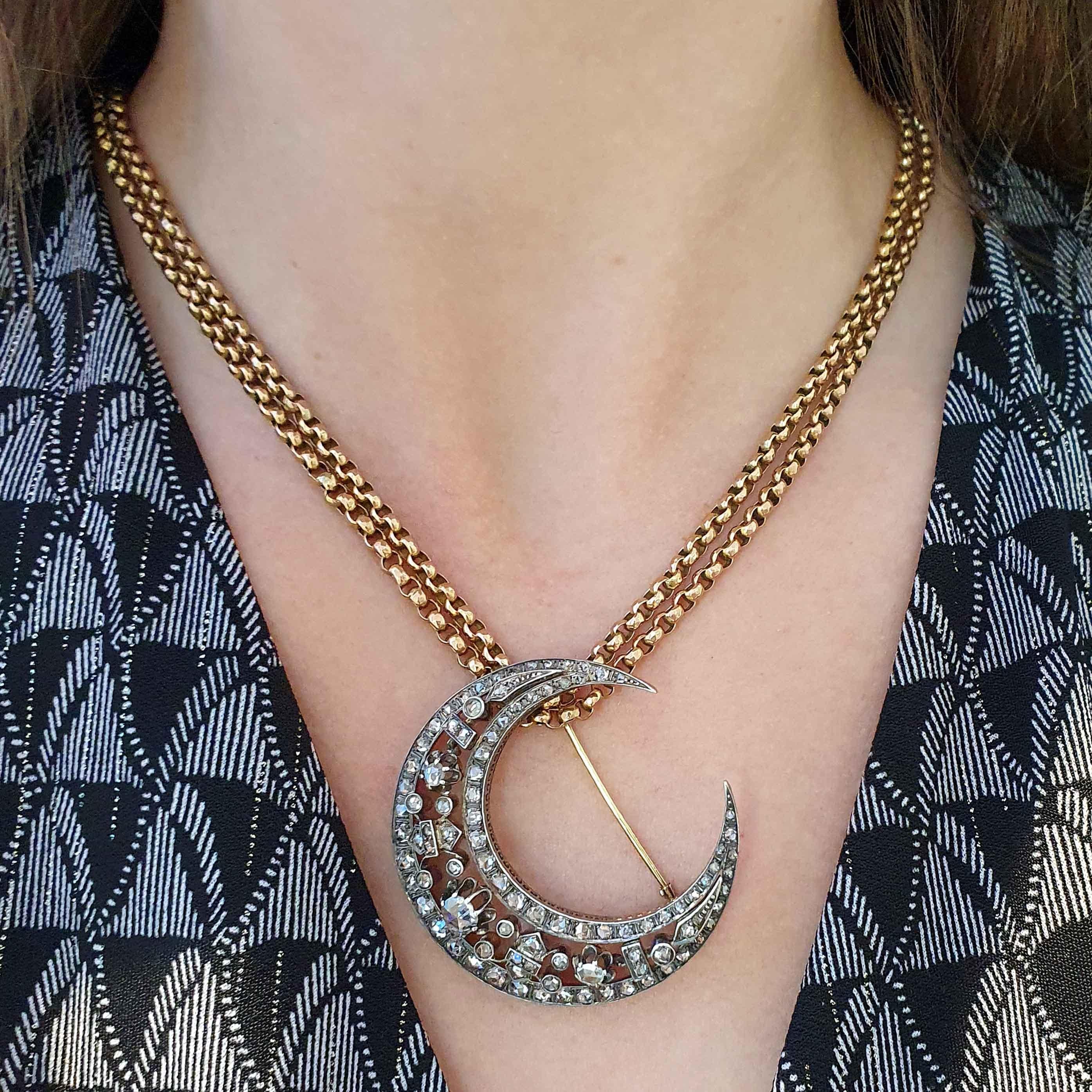 Antique Crescent Rose cut Diamond Brooch/Pendant silver and gold on a Necklace Chain 18K gold. 
Late 19th Century.

Crescent diameter: approx. 5.00 centimeters.
Crescent weight: 17.04 grams.

Antique Chain 18K gold. French marks.
Length: approx.