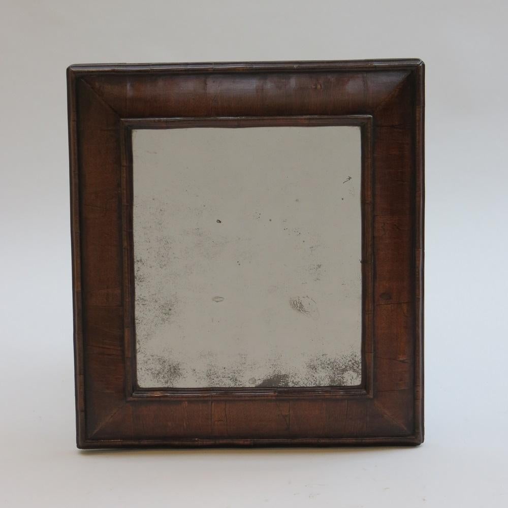 Good quality antique cushion mirror from the 19th century. Very nice, authentic cushion mirror from the late 19th Century, in the style of a 17th century cushion mirror. The frame probably originated as a picture frame and has been converted to a
