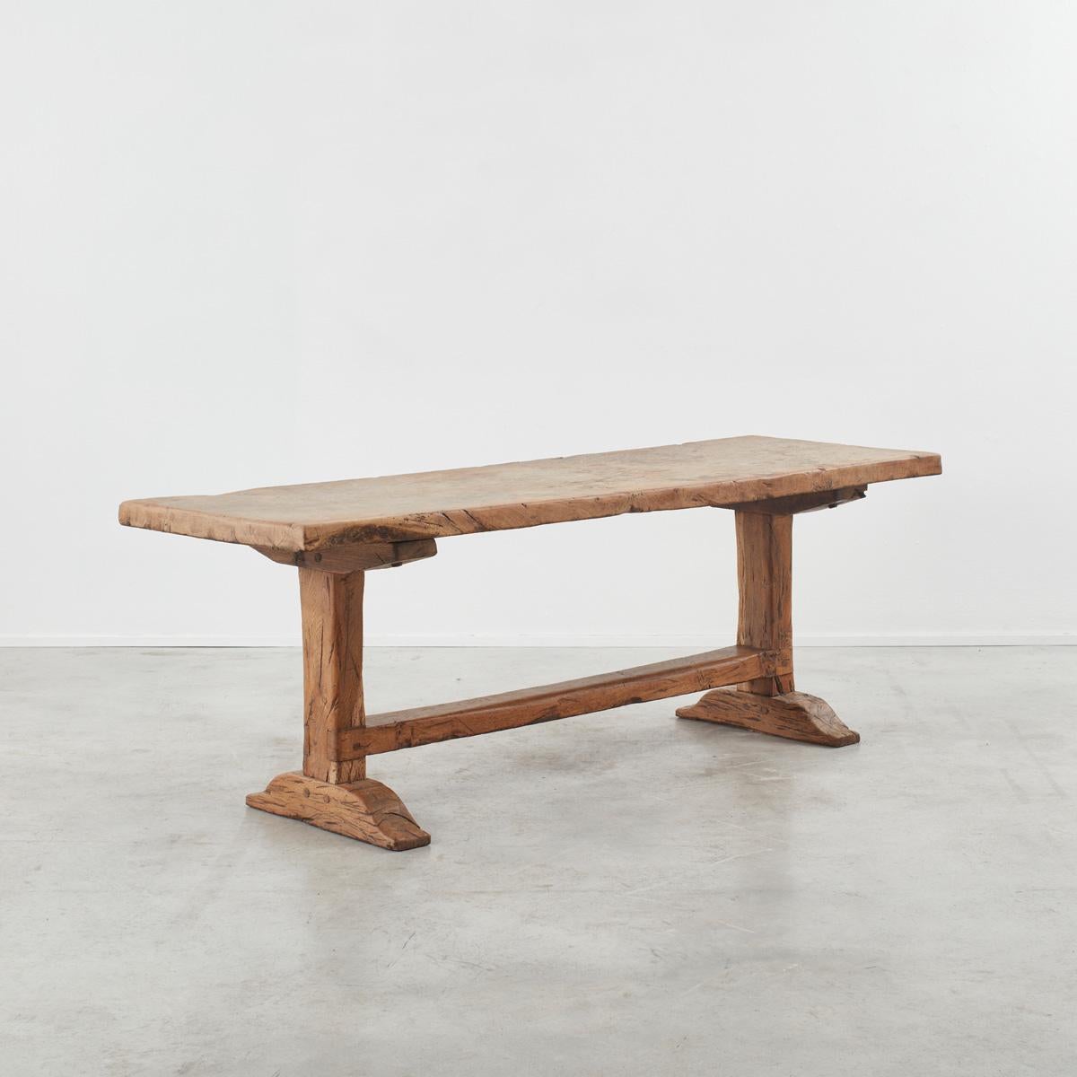 Thick slab-topped monastery table from the Auvergne region of France. Lovely natural dry and gnarled finish with heavily patinated surface due to years of near constant use. Been through various sympathetic restorations over the centuries with parts
