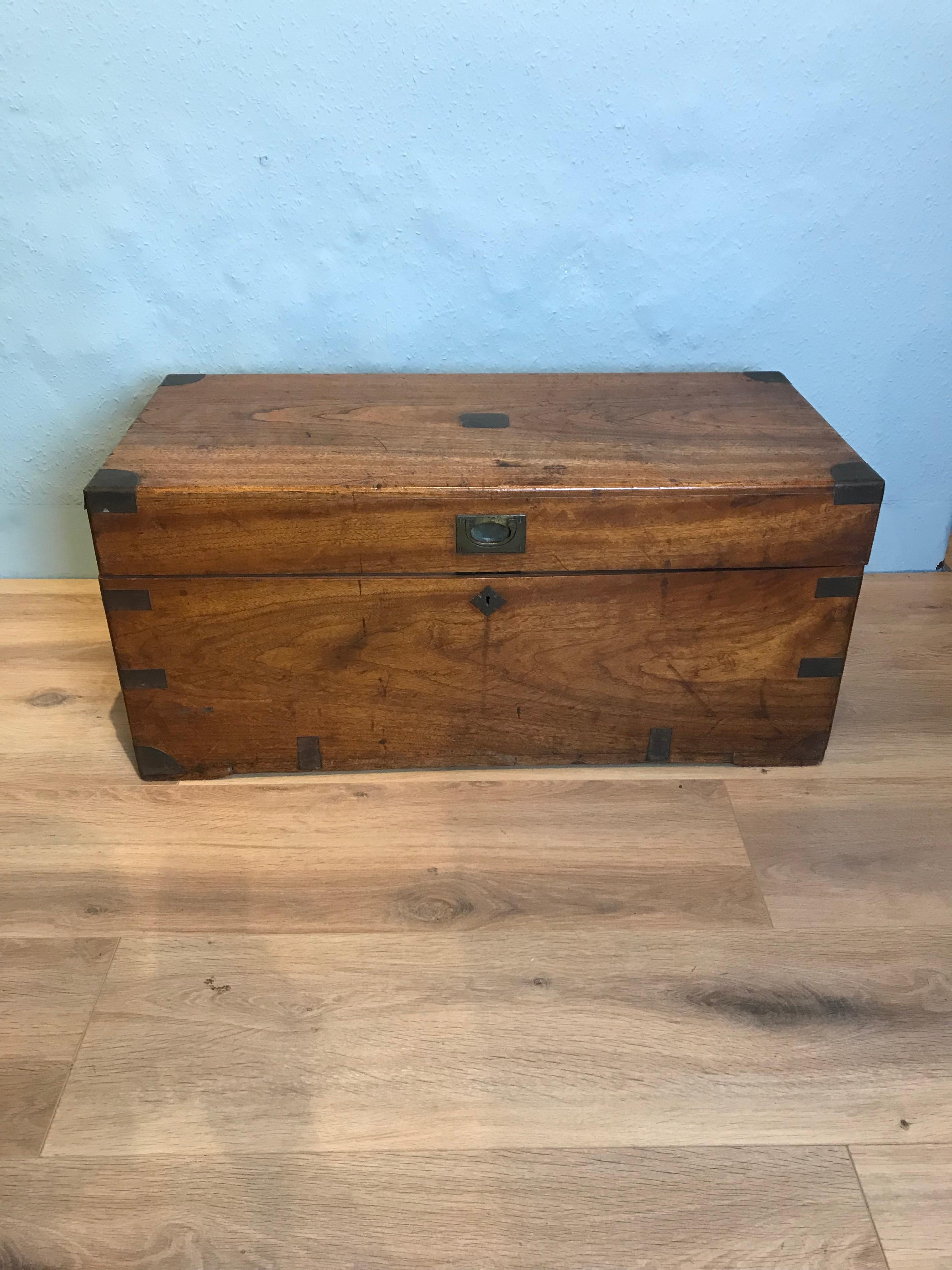 An attractive 19th century camphor chest with original patina and brass work including carrying handles. This useful chest which can be used as a coffee table as well as for storage, has a pleasing honey colour and good figure to the camphor wood.