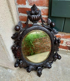 19th Century Antique English Carved Dark Oak Oval Wall Mirror Black Forest Style