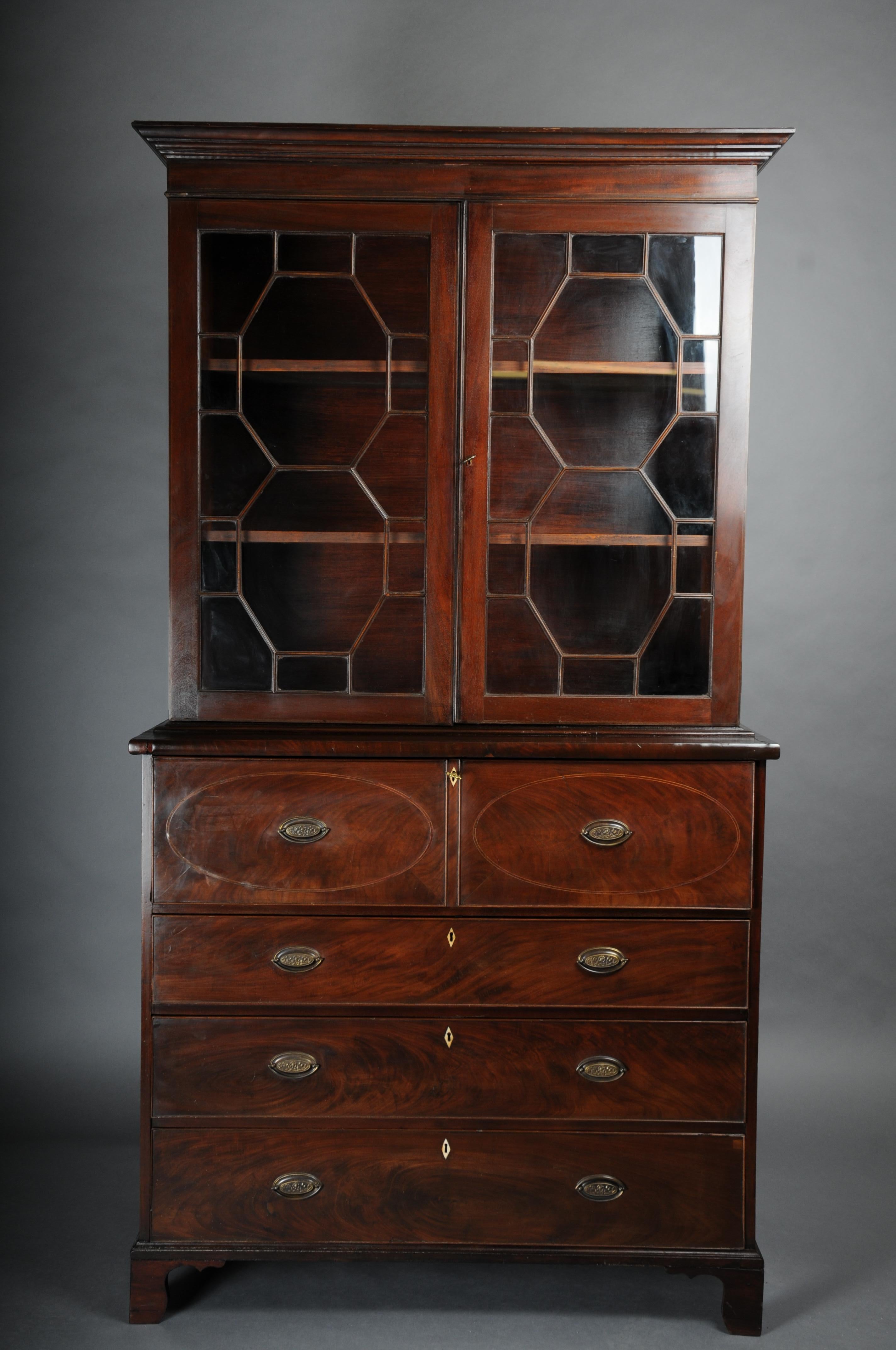 19th Century Antique English Display Secretaire, Mahogany

Solid wood, manufactured to a high quality. The display cabinet has a pull-out function and can be used as a secretary thanks to the integrated writing surface.

Above, glazed cupboard door