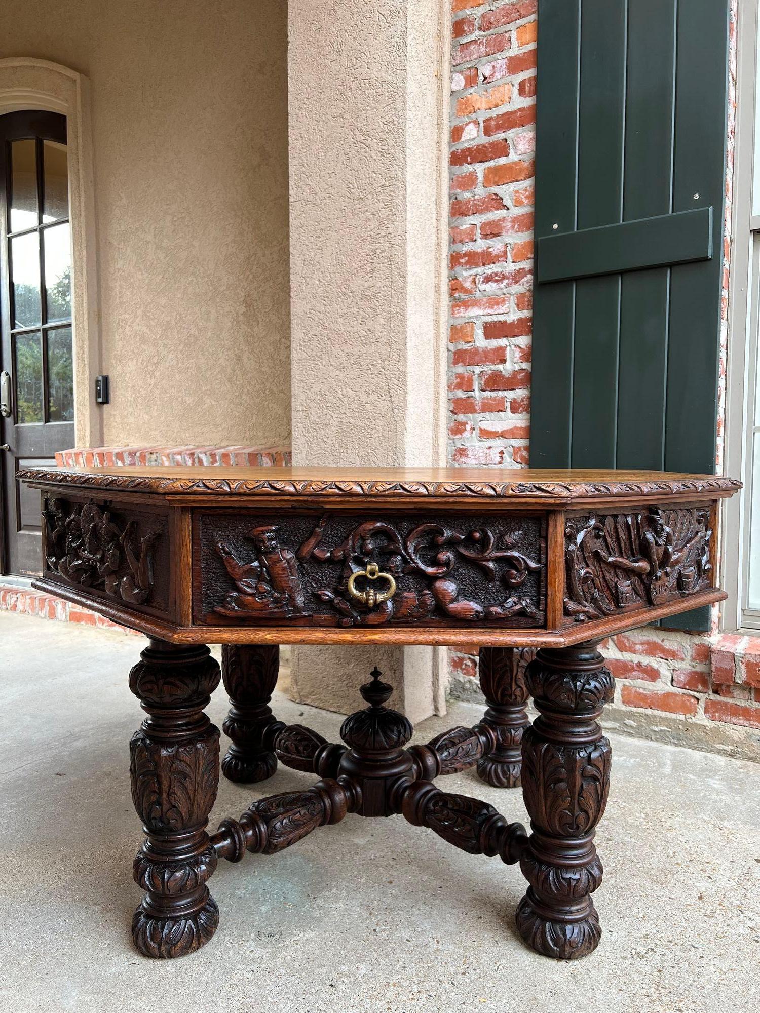 19th century antique English octagon center table whimsical game carved oak.
Direct from England, and truly an antique treasure, this amazingly hand carved octagon table. Eight wide sides, four having drawers and four fixed sides…yet each has an