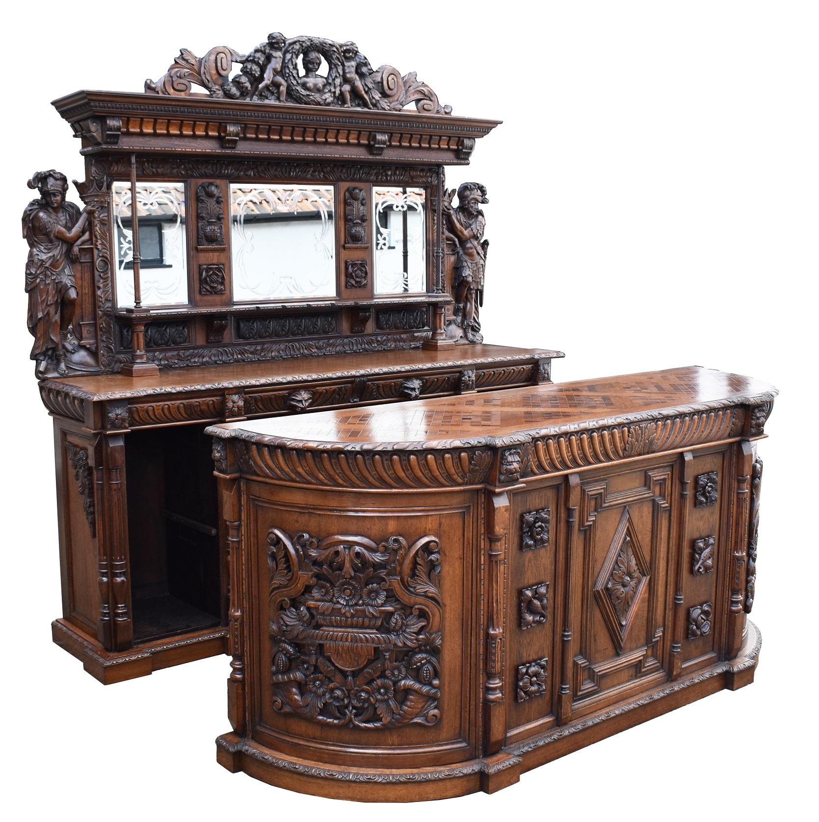 For sale is a fine quality 19th century carved oak bar heavily influenced by 18th century style, having an ornately hand carved pediment depicting a female figure to the centre, surrounded by a wreath flanked by a cherub on either side, terminating