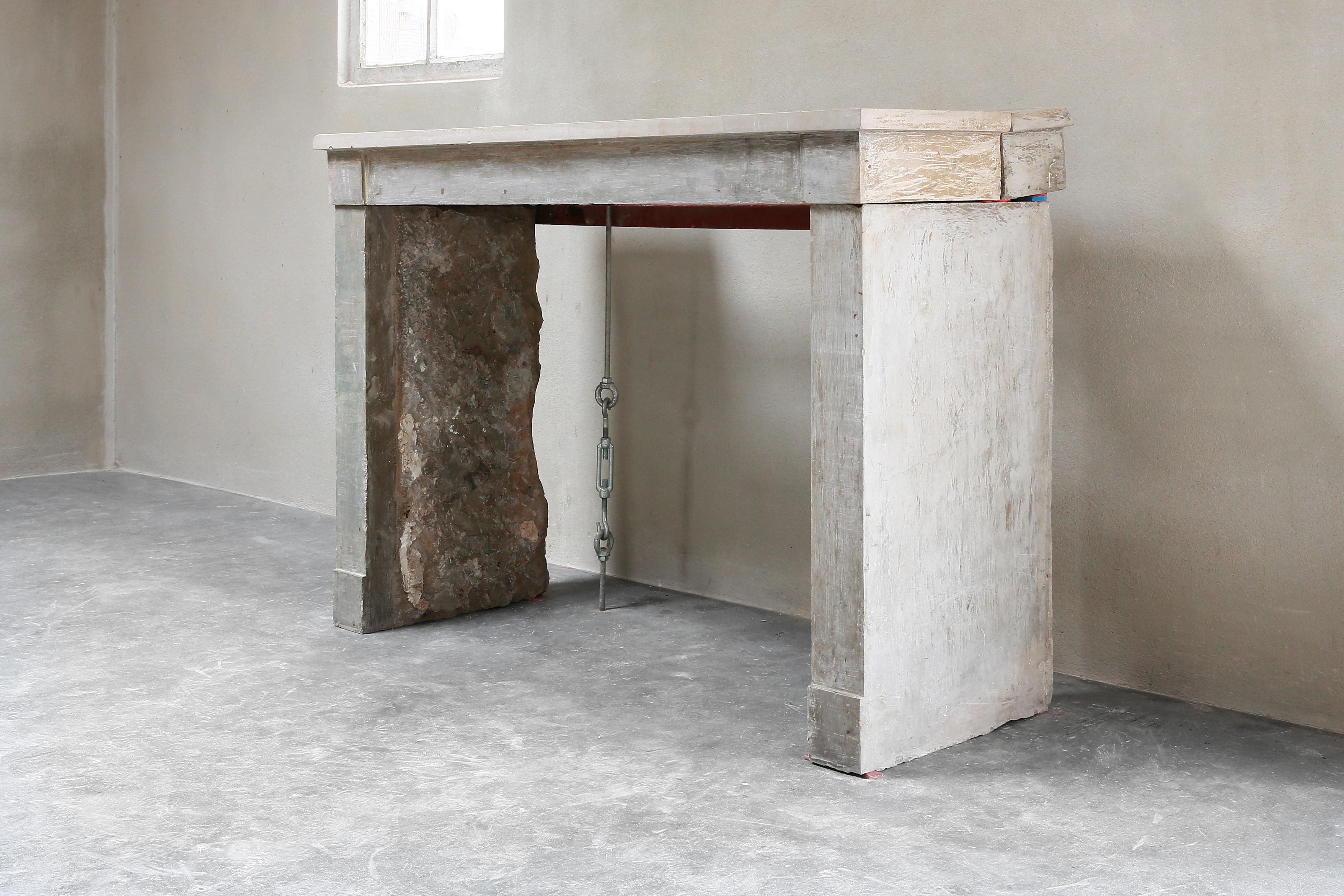 Beautiful rustic antique fireplace made of gray marble stone. A fireplace from the 19th century in the style of Campagnarde. This straight fireplace fits very well within a contemporary or modern interior, but this fireplace also comes into its own