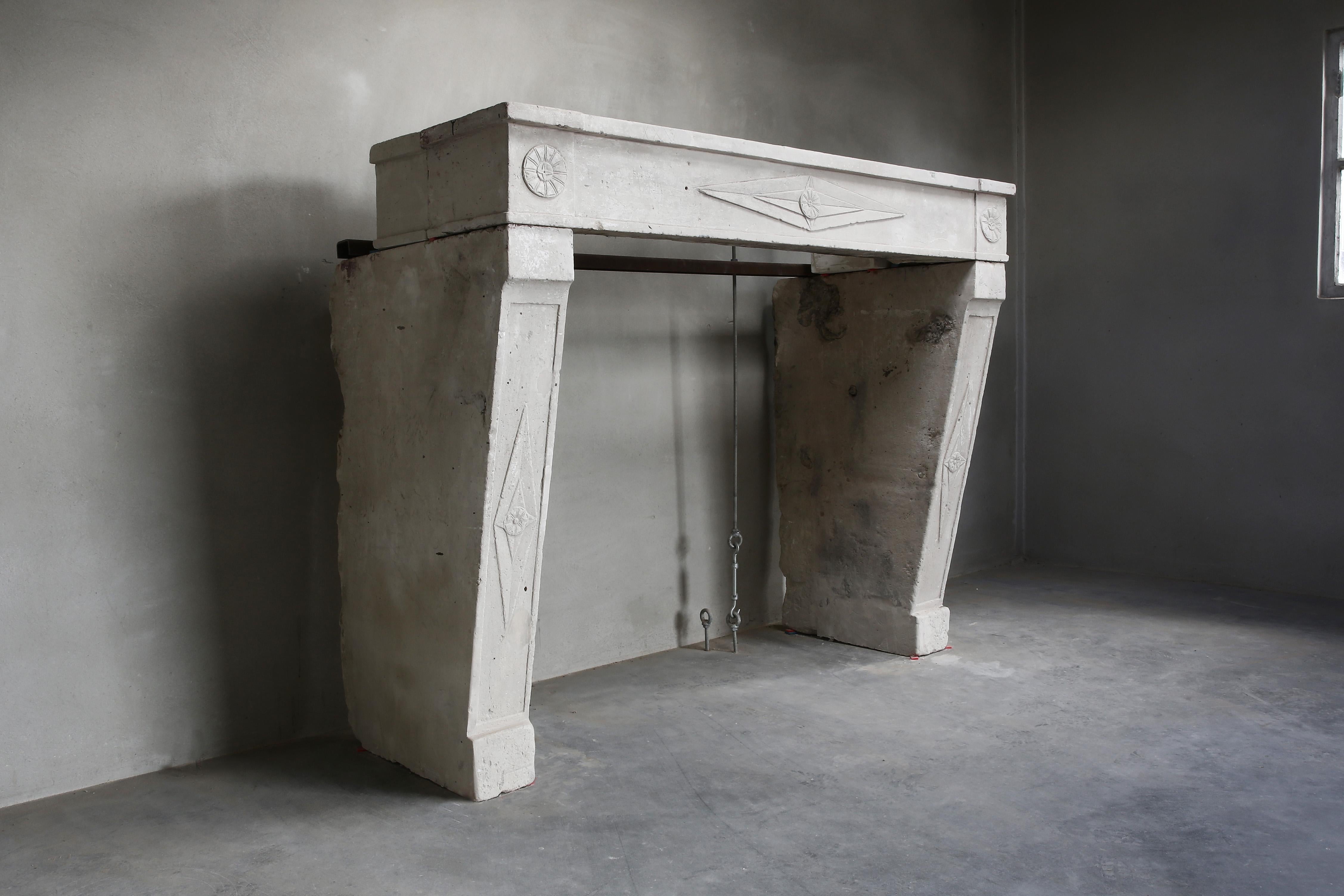 Beautiful antique fireplace in Campagnarde style from the 19th century. A fireplace that is robust, but also elegant because of the ornaments that are incorporated in it. A beautiful fireplace of French limestone with a stately character.