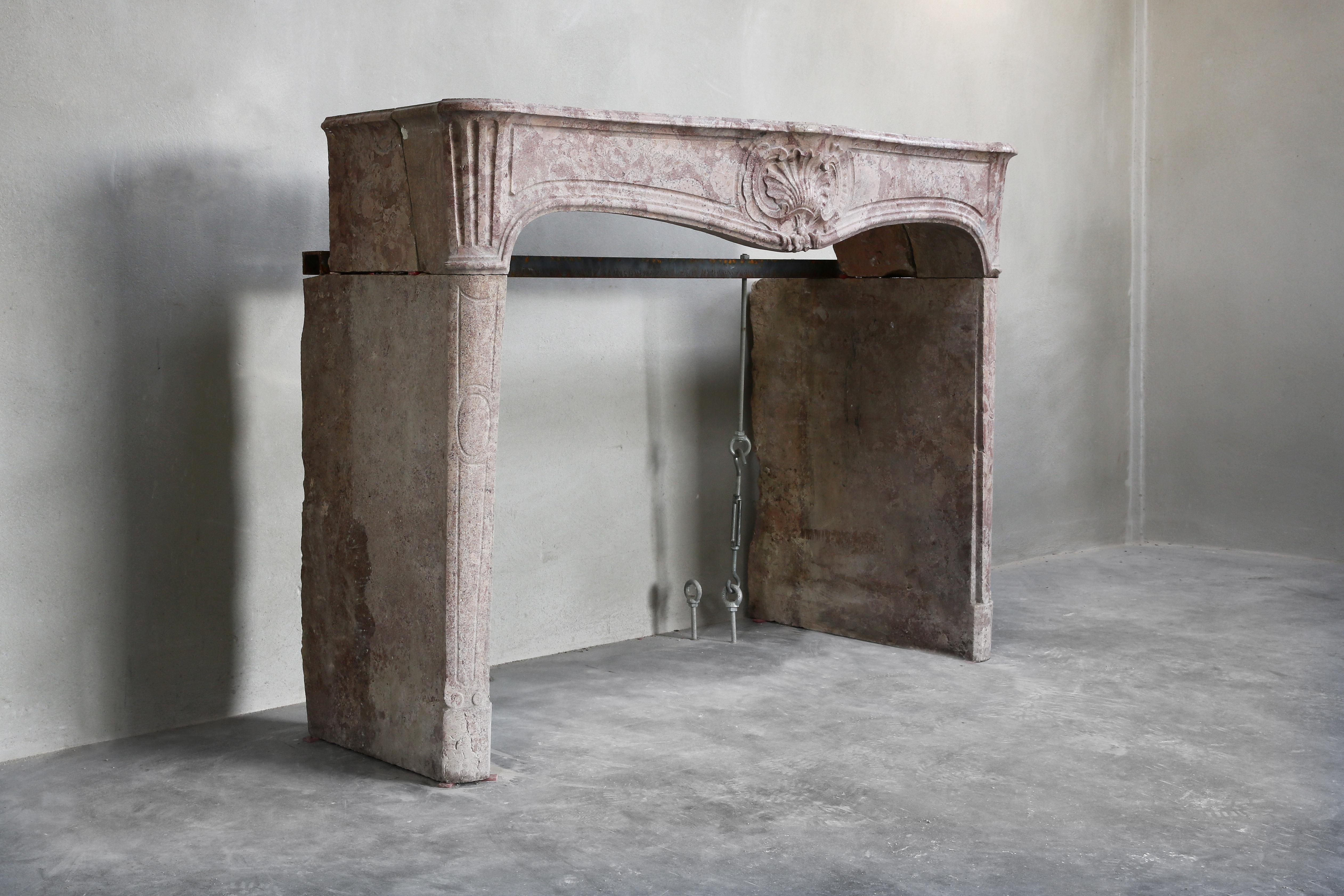 Beautiful antique marble stone fireplace! A very special item because of the color. This is a color that we don't see often and that makes this antique fireplace unique. This fireplace dates from the 19th century and is in the style of Louis XV.