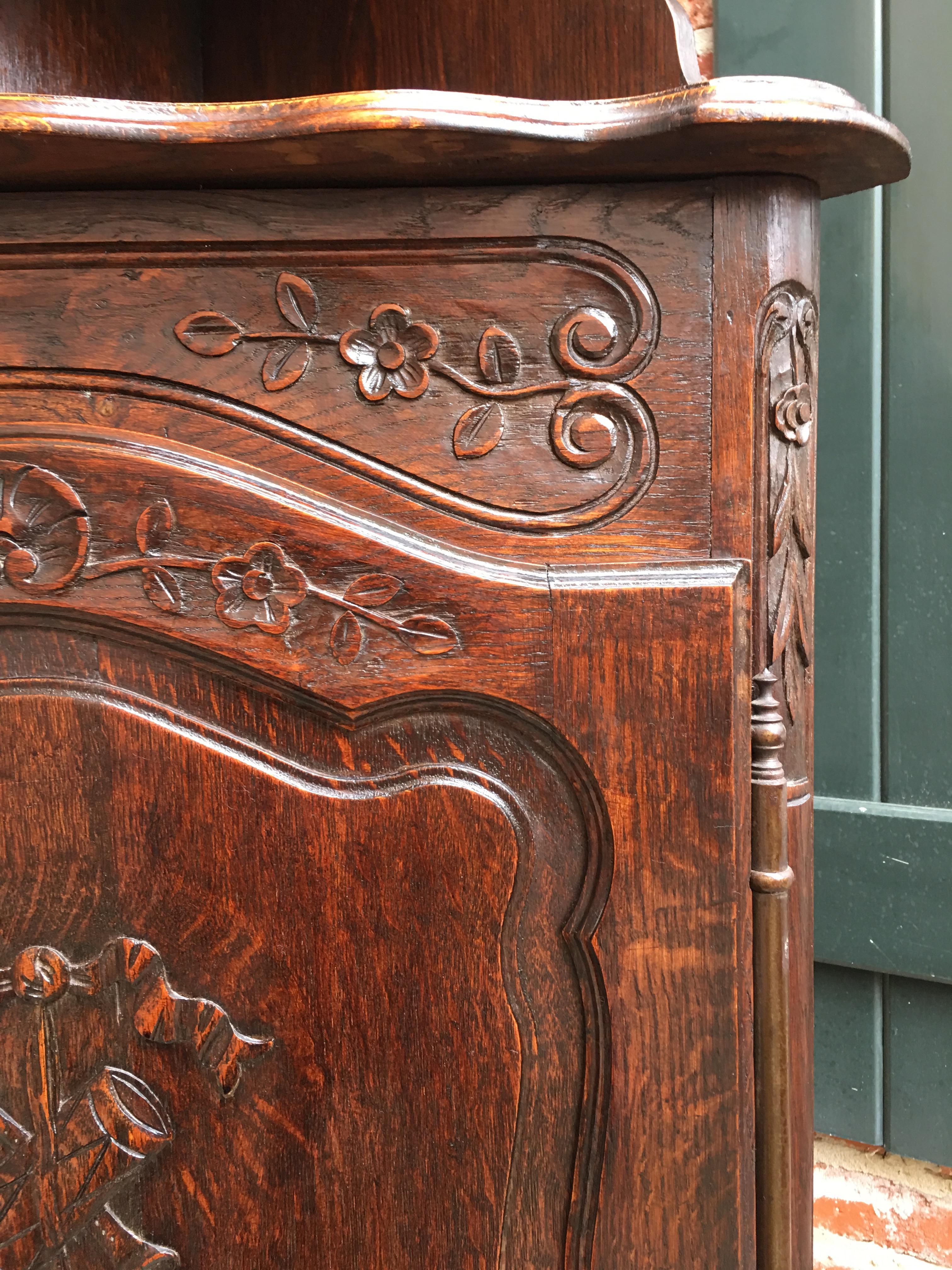 Direct from France, a lovely and unique antique French corner cabinet~
~Beautifully hand carved upper crown with serpentine edges and finials~
~Wide carved serpentine apron on each of the gallery edge shelves~
~The lower cabinet is also completely