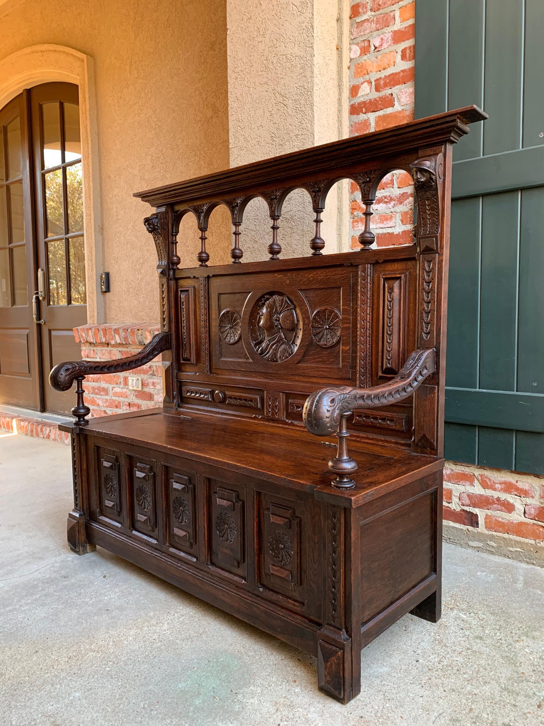 19th century Antique French Carved Oak Hall Bench Brittany Breton Tall Pew Chest

~Direct from France~
~Large antique French carved hall bench, with gorgeous hand carved features!~
~Upper back panel features dimensional carved male/female faces