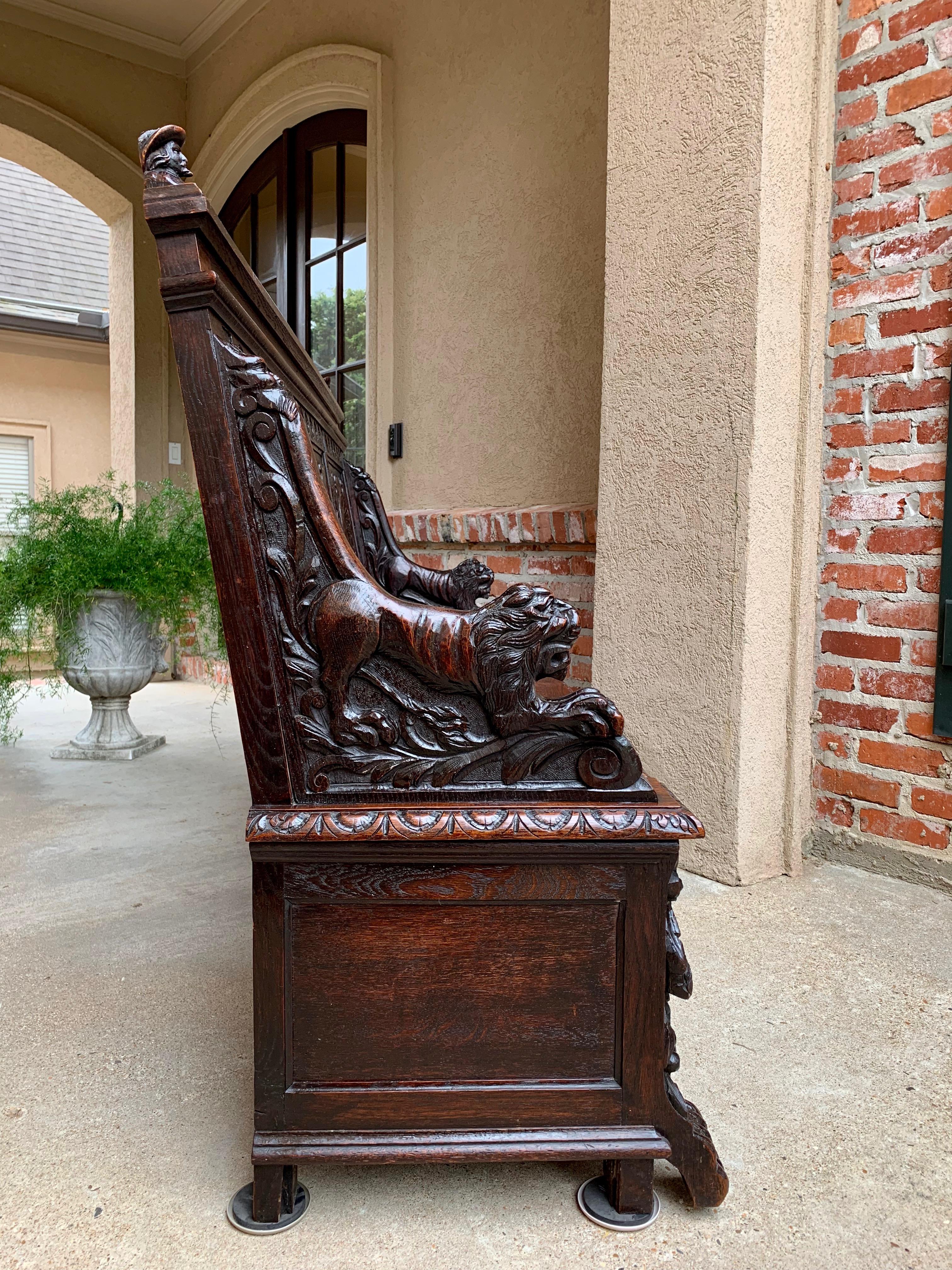 Direct from France, outstanding antique carved French bench, one of the most elaborately carved oak Renaissance hall benches we have found in years and definitely a piece of art!
~Meticulously carved recumbent lions create the arms on either