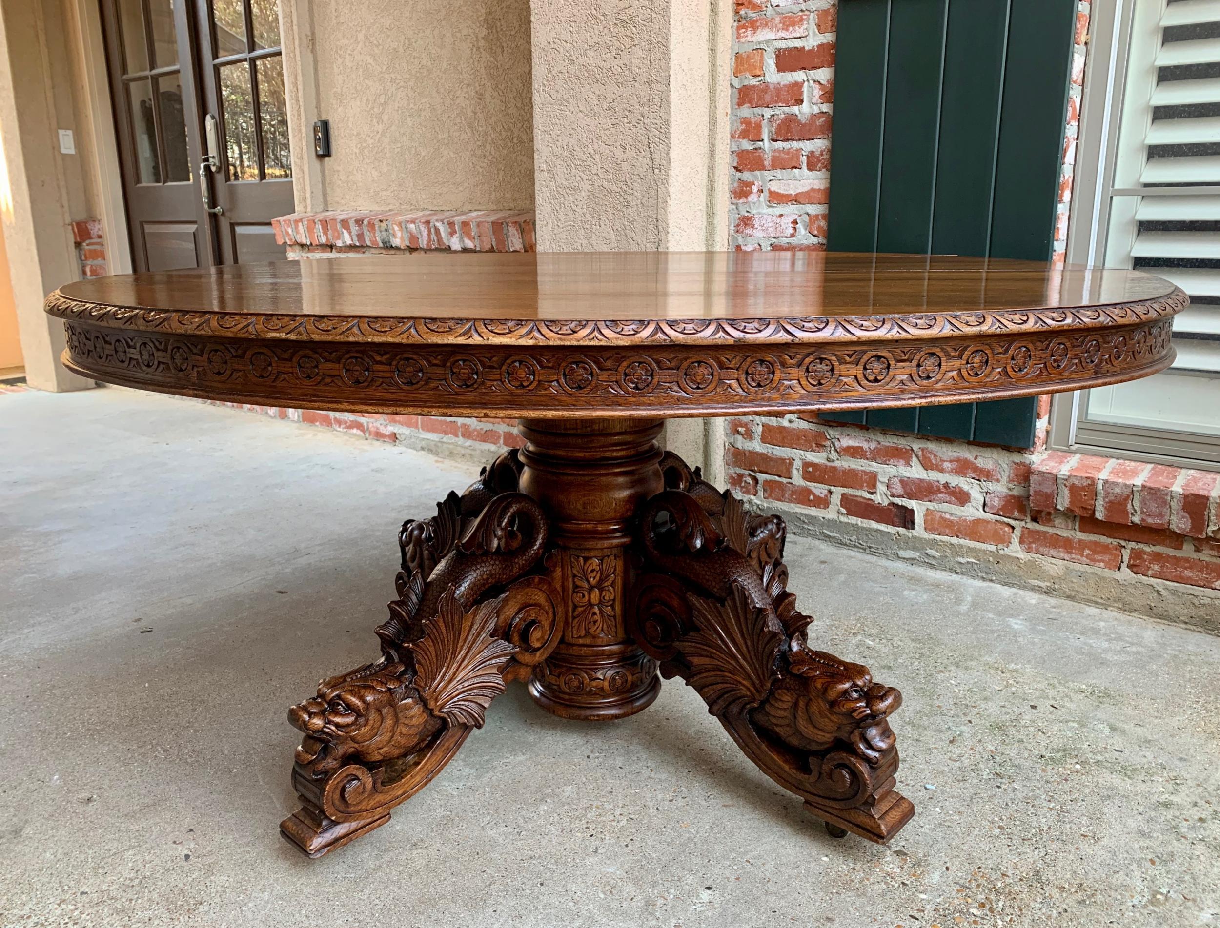 19th century Antique French carved oak oval dining table Renaissance Louis XIV

~Direct from France~
~Majestic and substantial antique French carved oak dining table!~
~Stunning hand carved details; one glance reveals the superior quality of the